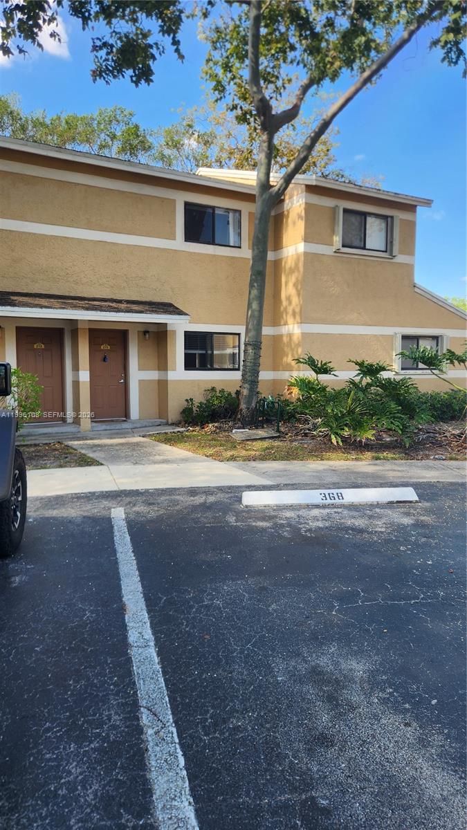 Only for Investors -Property Rented - Townhouse-style condo featuring 2 master bedrooms upstairs and a guest half-bath on the first floor (2.5 baths total). The unit offers an open living/dining area with a lake view. Includes washer and dryer inside the unit and an assigned parking space conveniently located right in front. The community features on-site management, a clubhouse, heated pool, and tennis court. Currently rented to a good tenant until 5/31/2027. Great opportunity for an investor seeking stable Income and cash-flow. Additional parking available. -