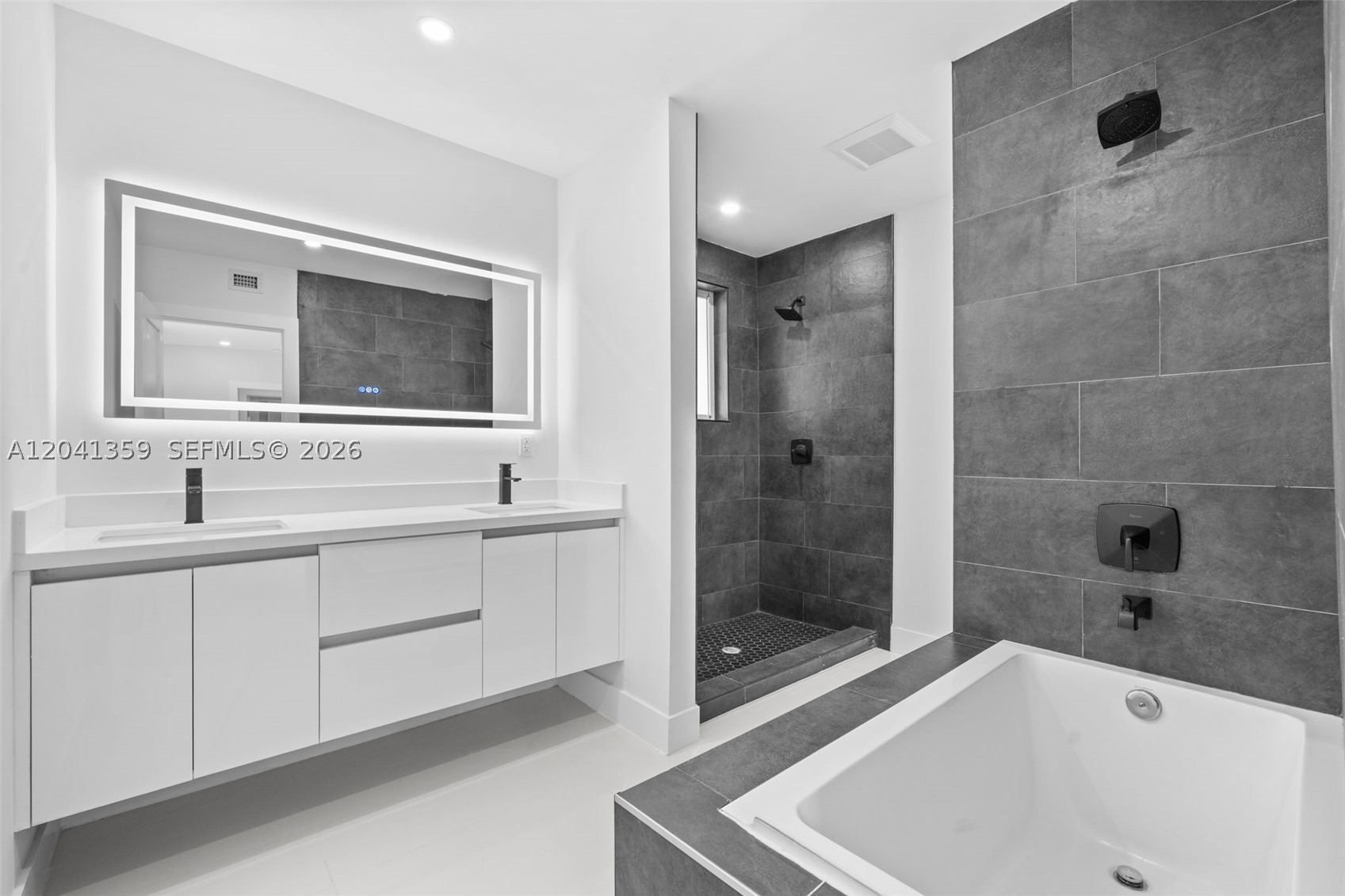 Beautifully renovated modern home in the heart of Miami offering 4 bedrooms and 3.5 bathrooms, including a private detached guest suite. The separate suite provides the perfect space for extended family, guests, a home office, or the opportunity to generate additional rental income. The main residence features bright open living areas, a sleek contemporary kitchen with custom cabinetry and stainless steel appliances, spa-inspired bathrooms, and a spacious walk-in closet. Enjoy a large covered terrace overlooking a generous backyard ideal for entertaining or relaxing. Gated front entry provides privacy and curb appeal. Prime location just minutes from Brickell, Downtown Miami, Coral Gables, and major highways, offering the perfect blend of comfort, style, and convenience.
