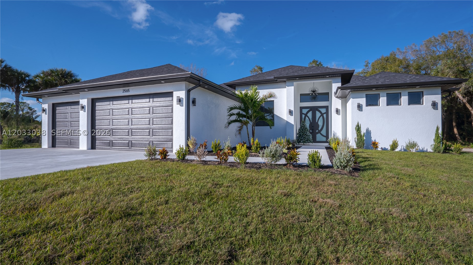 MOTIVATED SELLER! BRAND NEW 2025 CONSTRUCTION in Golden Gate Estates. This stunning 4-bedroom, 3-bath home offers a 3-car garage and sits on 2.27 acres with no HOA. Features include impact windows and doors, high ceilings, and a modern open-concept layout designed for comfort and entertaining. Enjoy outdoor living with a summer kitchen and spacious patio overlooking a canal in the rear. Horses allowed. Cash buyers welcome. A rare opportunity to own a brand-new home on acreage in a highly desirable area.