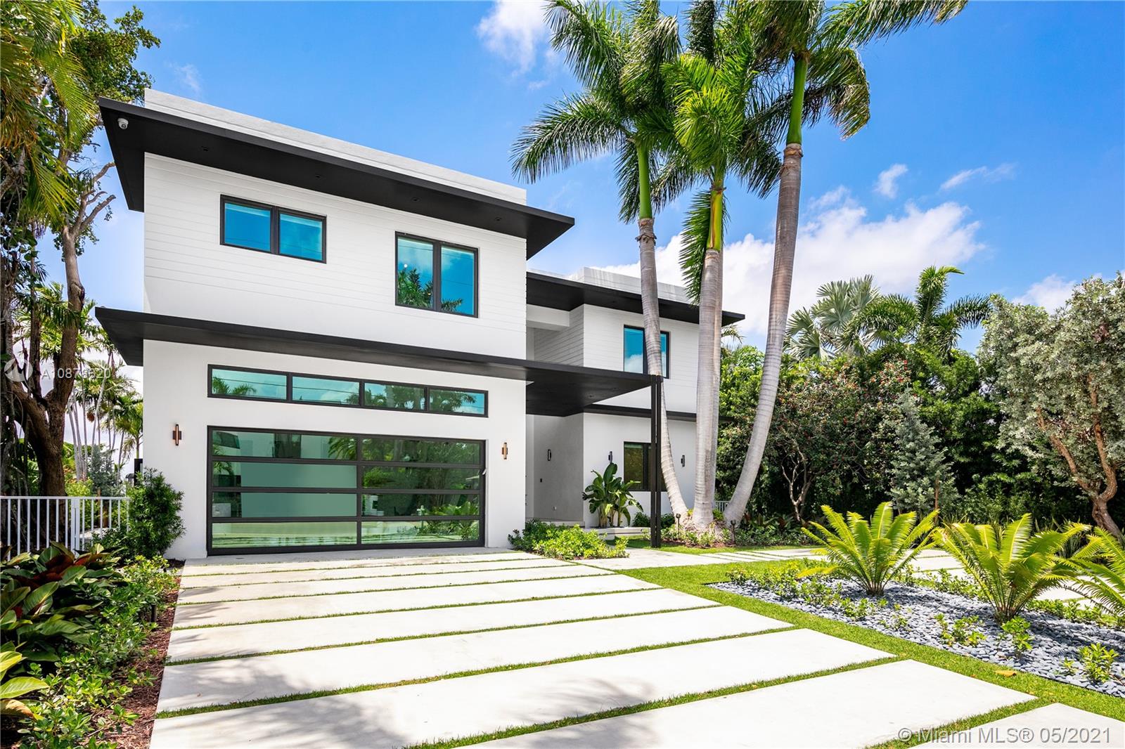 Situated on the Open Bay w/ endless water & west sunset views, this Completely Rebuilt Contemporary home features 7100 SF of Living Space complimented by top of the line finishes throughout. Enjoy a perfect layout for family living & entertainment which features 8 BD, 8.5 BA + home office. The 1st floor sets the tone w/ 60x60 porcelain tiles, one of a kind staircase w/ live green wall & a Snaidero Kitchen comprised of wood taken from the pilasters of Venice. Upstairs you'll be blown away by the master retreat which boasts breathtaking western views of the bay & sunsets, private lounge / sitting room, bespoke master bathroom w/ steam shower & enormous his & hers closets. The backyard provides a tropical setting w/ pool & spa, new seawall cap & brand new 60' dock.