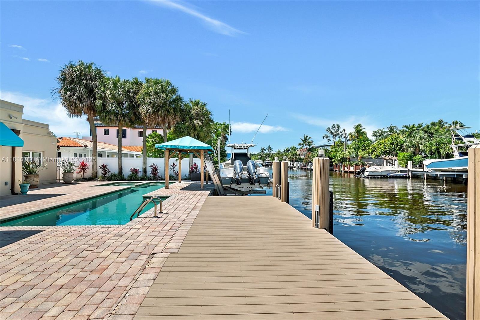 Prime Las Olas Isles waterfront opportunity with 75 feet of frontage—offered under $3 million! Enjoy an unbeatable location just a short walk to Las Olas Boulevard’s restaurants, shops, and nightlife, plus easy access to the beach.
This well-maintained home is full of charm, featuring a private, enchanting courtyard that’s perfect for entertaining. The home also presents a rare opportunity to convert the upstairs into a separate guest or family suite with private exterior access. For boaters, this property checks every box: no fixed bridges, about a 15-minute ride to the ocean, and dockage for up to a 65-foot boat. A rare chance to own in one of Fort Lauderdale’s most desirable waterfront neighborhoods.
