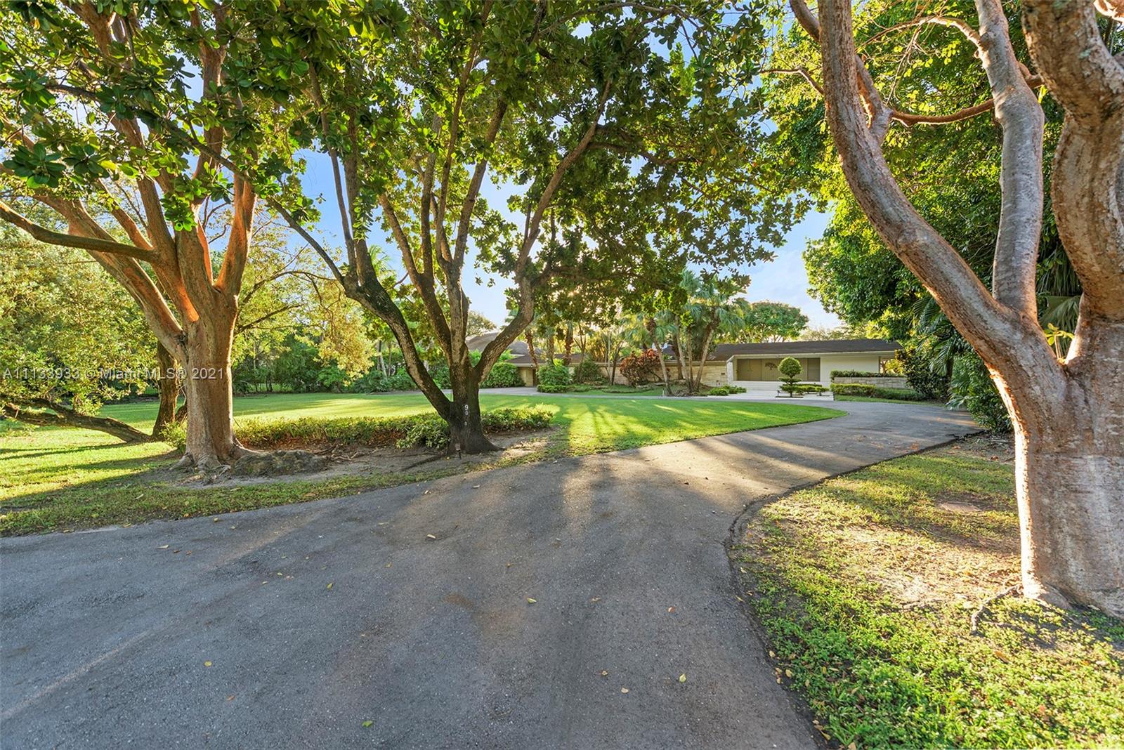 Restore, renovate or reimagine absolutely amazing Mid-Century Modern home, or build your own dream sanctuary on the gorgeous Hammock Lakes waterfront acre+. Its fabulous lakeside location is PRIME:Enjoy the priceless benefits afforded by a prestigious, close-in gated community, a plum Schoolhouse Rd address adjacent to W Matheson Hammock Park (a vast green open space), prevailing easterly breezes & spectacular western sunsets. Drink in the serene vista poolside or from the poured concrete dock. The visionary 1961 residence was built for the ages; its great bones, clean lines, high ceilings posess a timeless esthetic. The front exterior wall, striking interior central fireplace and other architectural details are masterfully crafted from locally quarried oolitic limestone.