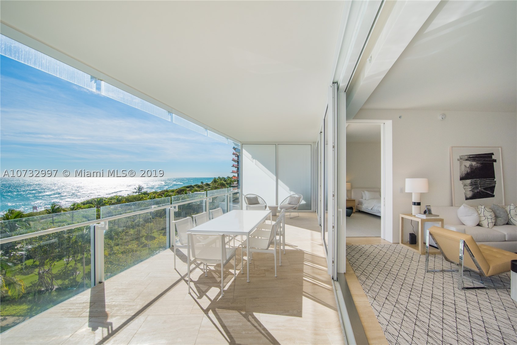 Enjoy Legendary Living at the The Surf Club Four Seasons in this stunning oceanfront residence. Private foyer leads to an open & spacious living space, offering 60 lineal feet of ocean front w/12' deep frameless glass terrace capturing endless views of the ocean & surrounded by lush tropical gardens. 2 oceanfront master bedrooms w/en-suite bespoke baths + generous & flexible living/media/bedroom space w/full bath. Experience 5 star service throughout The Surf Club w/8 acres of land & 815’ of oceanfront. Four Seasons amenities include Le Sirenuse Restaurant, The Surf Club Restaurant by Thomas Keller, 24hour Doorman, Concierge, 3 resident only swimming pools, beach service, state-of-the-art fitness center, oceanfront spa, children's club room, inhouse dining & housekeeping services.