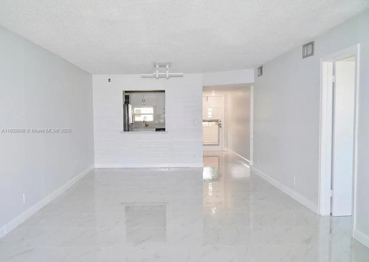 Welcome to your new oasis at 691 S Hollybrook Dr! This beautifully updated condo offers a spacious layout with two bedrooms and two bathrooms, perfect for comfortable living. The bright and airy kitchen features modern appliances and a breakfast bar, seamlessly connecting to the inviting living area. 

The Hollybrook community offers a wealth of amenities to enhance your lifestyle. Dive into relaxation at the community pool, stay active in the fitness center, or enjoy a leisurely stroll along the scenic walking paths. With golf courses, tennis courts, and a clubhouse available, there’s no shortage of ways to stay entertained. Convenience is at your fingertips with nearby shopping, dining options, and easy access to major highways
