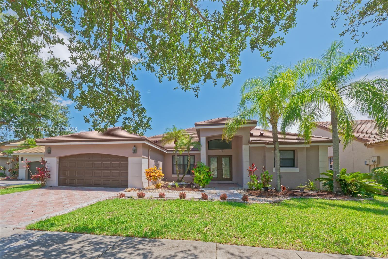 Freshly painted and ready for move in. Spacious, lake-side, pool home on a secluded cul-de-sac. Soaring high ceilings. Positioned on a peninsula with peaceful lake views. HUGE master bedroom with two walk-in master closets. Split floor plan. Screened in pool. Newer stainless steel appliances. New tile. Feel safe with security of Impact windows. Highly-rated Weston schools of Eagle Point, Tequesta and Cypress Bay. Gated security within beautiful master planned The Lakes development. Ready for move in asap.