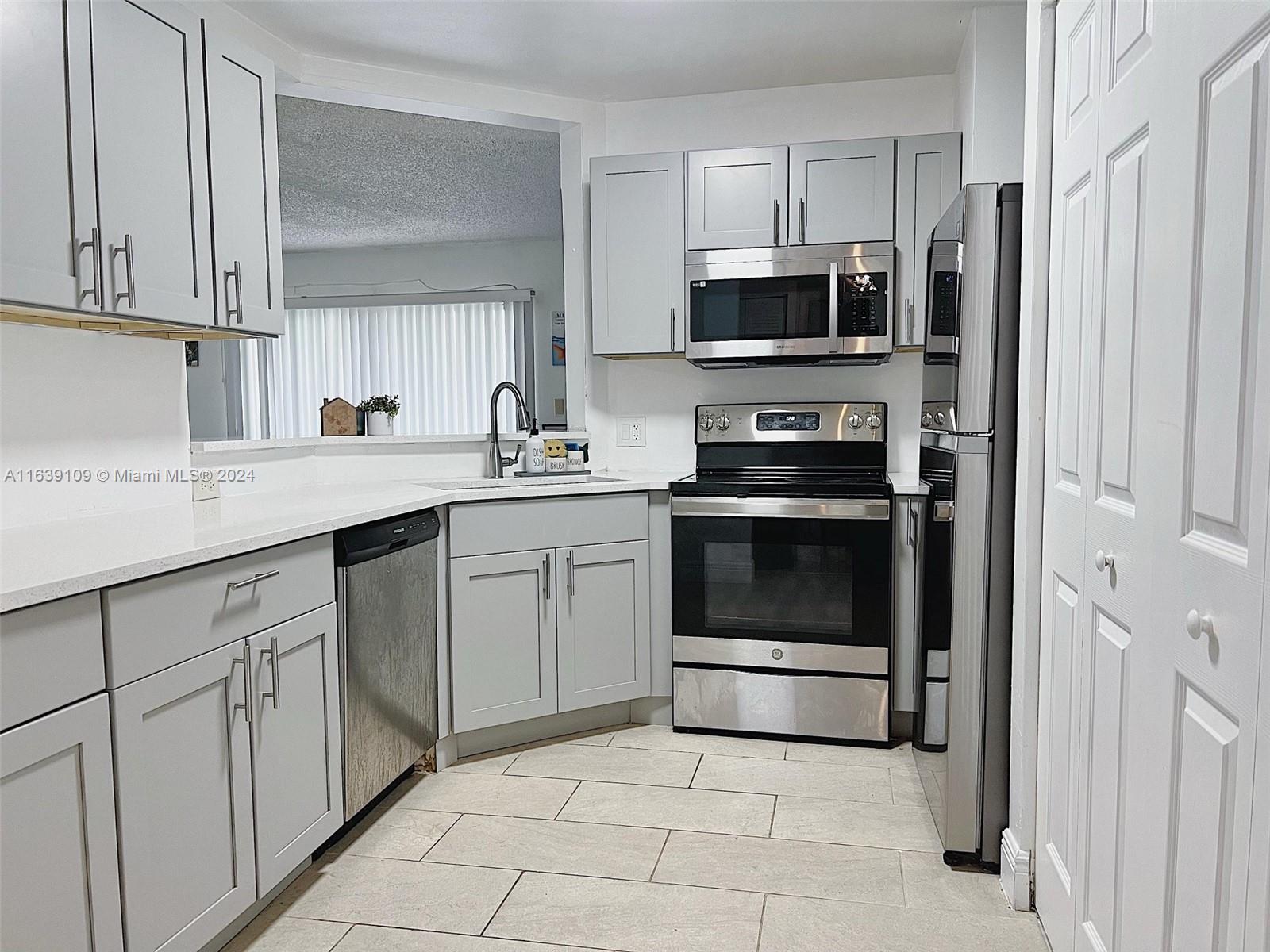 Experience serene living in this first-floor corner condo with stunning lake views. Located in the peaceful Summer Lakes Community, this upgraded unit features a modern kitchen with quartz countertops, new cabinets, and stainless steel appliances. The main bedroom includes a walk-in closet and a newly remodeled luxurious marble bathroom. Enjoy in-unit washer/dryer hookups and the flexibility to rent immediately. Community amenities include a resurfaced pool, hot tub, gym, grills, and lakeside benches. Just 2 minutes from the Turnpike, 5 minutes from I-95, and 15 minutes from the beach.