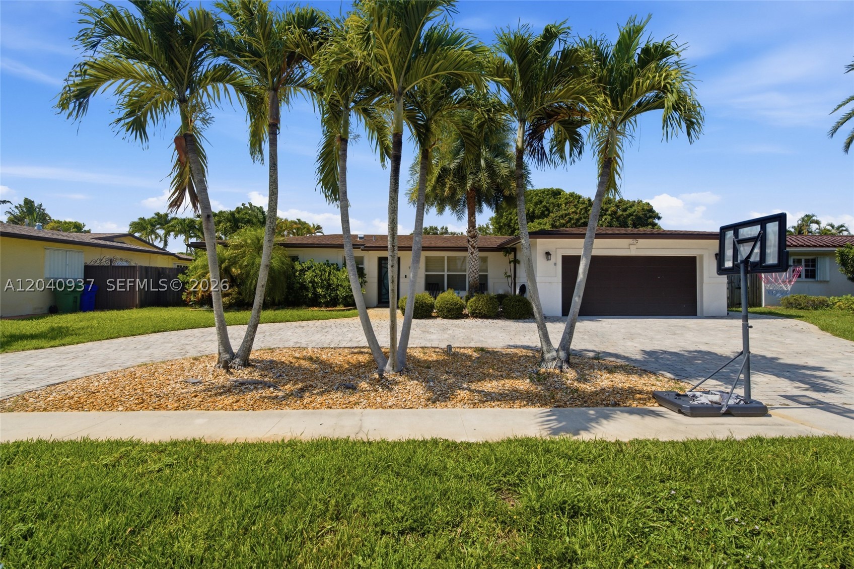 Welcome to this beautifully updated home nestled in one of Pembroke Pines most desirable communities, where comfort, style & peace of mind come together. Situated in a quiet, family-friendly neighborhood with top-rated schools, this exceptional residence offers the perfect blend of indoor elegance and resort-style outdoor living.
Designed for both entertaining and everyday enjoyment, the backyard is a private oasis featuring a sparkling pool, lush turfed patio, built-in BBQ area, and a stunning gazebo overlooking the pool and lounge area. Enjoy gatherings year-round with both covered and open-air patios ideal for dining and relaxing. The fully fenced yard offers privacy and plenty of space for family and pets. Inside, you'll find a thoughtfully updated interior with granite countertops, SS appliances, a spacious pantry, custom built-in closets, and timeless plantation shutters throughout. Impact windows and doors provide security & energy efficiency; a 9-year-old roof & a standby Generac generator offer added peace of mind. The oversized 2-car garage is a standout feature, complete with air conditioning and durable rubber flooring; perfect for a gym, workshop, or additional recreation space. A circular driveway adds curb appeal and convenience. Centrally located near premier shopping, restaurants, parks, and major highways, this gem delivers the lifestyle you've been waiting for. A rare opportunity to own a home where every detail has been designed for comfort & beauty.
