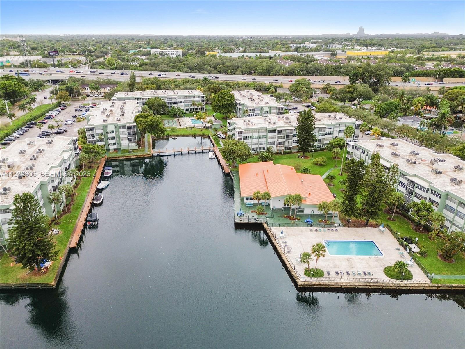 BRING YOUR BOAT | Ocean access dock! MOST CONVENIENT first-floor, corner unit features DIRECT INTRACOASTAL WATER VIEWS & PRIVATE ENTRANCE at the Watergate Condo in Hollywood. BEST LOCATION - 10 min. to the beach & airport, just off of I-95 & Sheridan St, near Dania Point, Memorial Hospital. Fully updated 2/2 unit with tile floors throughout, open kitchen with bar, big windows, bright natural light & lots of closets. Both baths are renovated, new vanities. Primary bedroom with ensuite customized closet & bath. Dock your boat & see it from the living room. Park the car & enter through large screened patio private entrance. Maintenance includes cable, water, trash, pest control. Storage unit, assigned parking & plenty of guest parking spaces available. Watergate Condo amenities include: 2 heated pools, tennis court, gym, sauna, BBQ, clubhouse, secured lobby. Furniture negotiable! Good reserves. NO ONGOING SPECIAL ASSESSMENTS. 50 year recertification just passed! Leasing allowed. Reach out to Listing Agent to schedule a showing TODAY!
