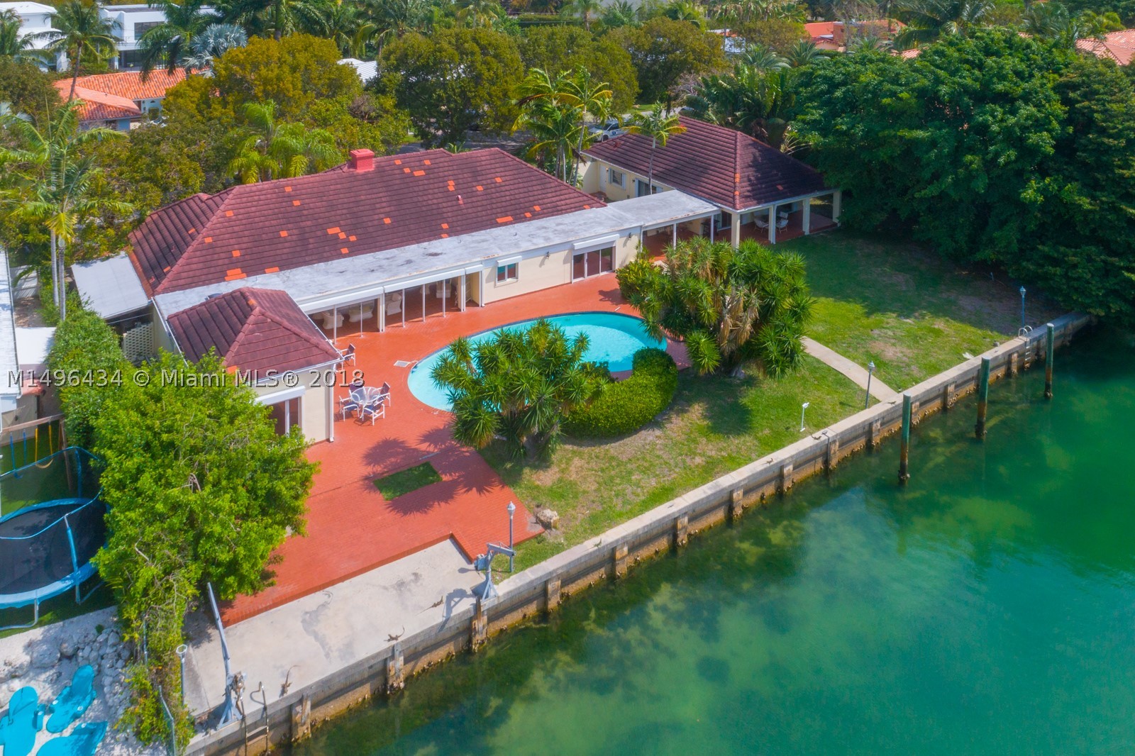 Location ... Location ... 160 Feet on the Water with 20,467 Sq Ft lot (as per the Survey) - SPECTACULAR and ONE OF A KIND. This is a gorgeous and amazing property with a house and a guest house. The main house has 3 bedrooms /3 Baths, living, dinning, kitchen and family room. The guest house has 2 bedrooms/ 2 Baths with separate kitchen and social area.  House is charming and in very good condition or you can “Build your dream home” on this oversized lot and unbelievable property where you can have every room with a view since there are 160 feel on the water.  This is a Boater’s paradise ! Property has 2 different folio numbers.  Easy to show.