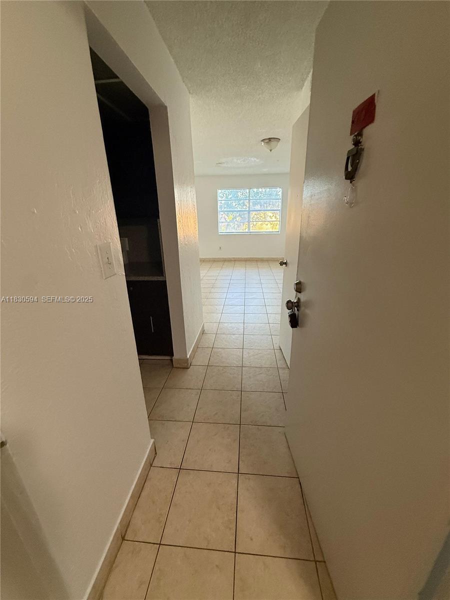 This spacious unit features 2 bedrooms and 1.5 bathrooms. The layout includes a living room, kitchen, and half bathroom on the ground floor, while the upstairs contains the two bedrooms and a full bathroom. It is equipped with a gas stove and has tile flooring throughout. The property is centrally located, providing easy access to highways and malls. Unit is rented for $1900 until Jan 31, 2027.