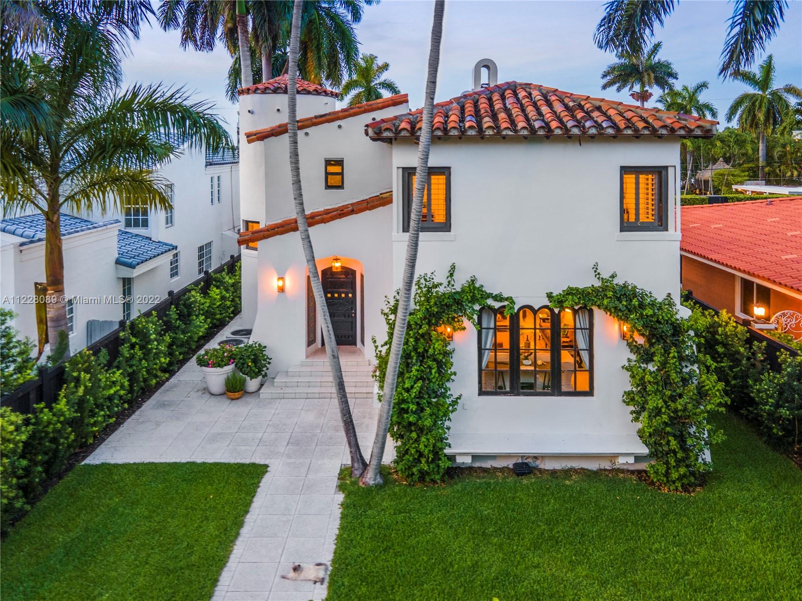 Rarely available, newly remodeled Villa on prestigious, 24hr policed & guard-gated Palm Island. One of Miami's most desired & exclusive neighborhoods w/ towering palms. This renovated, light & bright 2-story, 3,427SF, 5BD, 3.5BA home w/ 2-car garage sits on a lengthy lot that runs street to street. Originally designed by renowned architect George Fink, this residence boasts stunning architectural details, impact windows, gas kitchen w/ Viking stove, double ovens & Subzero Refrigerator, renovated baths, & a spacious courtyard w/ room for pool! 5 BD upstairs including attached guest quarters (perfect for in-laws & guests) that sits over garage w/ laundry room on 1st floor. Palm Island’s amenities include playground, & tennis & basketball courts. Streets have been raised to prevent flooding.