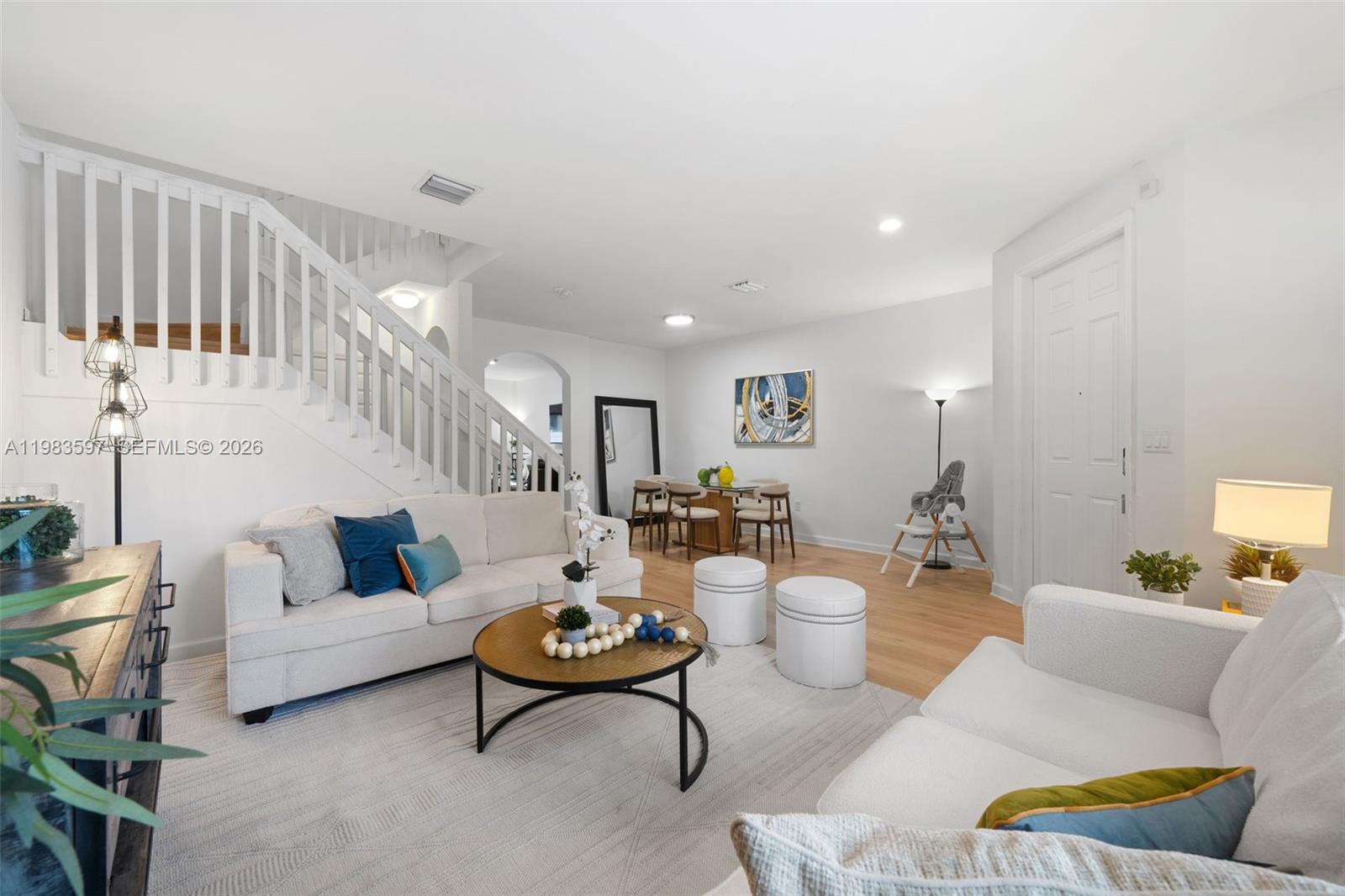 Welcome to Casa Aria — a spacious two-story townhome located in the gated community of Bonterra, a newer community built in 2016. This move-in ready home offers 3 bedrooms, 2.5 bathrooms and 1,668 Sq.Ft. The first floor features a bright and open layout with separate living and dining areas, plus a kitchen that flows into an integrated family room, creating comfortable spaces for everyday living and entertaining. The kitchen includes dark cabinetry, stainless steel appliances, quartz countertops, and generous prep space, combining functionality with a modern look. The home has also been updated with new wood-style flooring throughout, giving the interiors a fresh and contemporary feel. Upstairs you will find all three bedrooms, offering privacy and a practical layout, with good closet space and comfortable proportions. A powder room is conveniently located on the first floor for guests. The property also features a spacious backyard, ideal for outdoor relaxation, entertaining. Two assigned parking spaces are located directly in front of the home, with additional guest parking. Residents of Bonterra enjoy access to excellent community amenities including a clubhouse, fitness center, pool, basketball court, mini soccer field, playground, and entertainment areas, all within a gated community with 24-hour rover security and convenient access to major highways, shopping, and dining. A spacious and well-located townhome offering comfort, functionality, and community living.