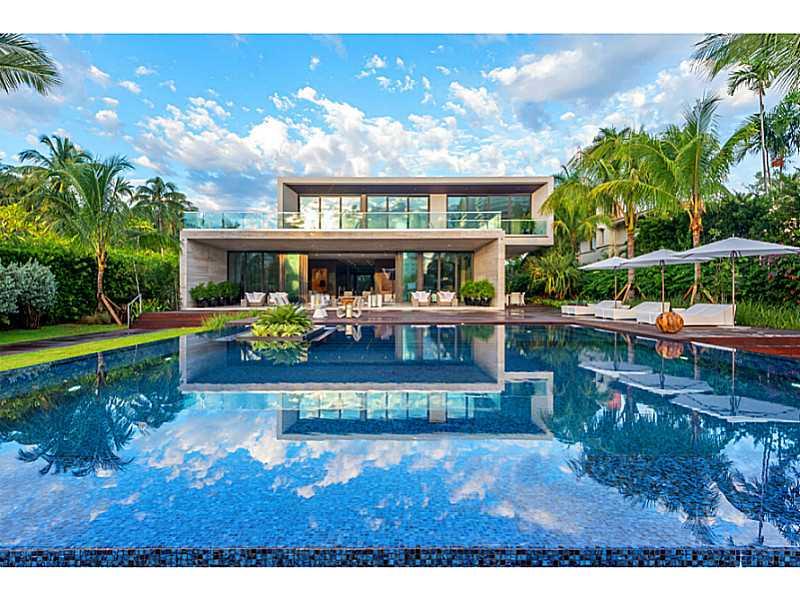 Located in the Prestigious Estate Section of Pine Tree Drive,this new contemporary home features a bold and innovative design by award winning Domo Architecture & Design. Situated on a 40,000 sq ft lot with 100 feet of water frontage this home boast every  amenity imaginable. Gourmet Kitchen, Media Room, 60' covered terrace,elevator, over sized pool/ spa and a separate floating pavilion with a state of the art gym+VIP guest suite.The latest creation from Mega Developer Todd Michael Glaser&The Posner Group.