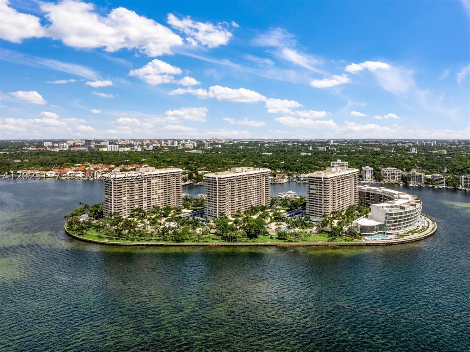 Experience unit C803 a beautifully renovated & luxuriously appointed 2 bedroom 2 bath condo at the exclusive, guard-gated island community of Grove Isle.  Spanning 1884 SF this exceptional home features a desirable split-bdrm plan filled with natural light & Biscayne Bay views from its elevated 8th-floor position. Overlooking the newly completed Vitas, an ultra-luxury waterfront condominium w/residences starting at $8.5M, C803 enjoys a coveted outlook further enhancing its appeal. Redesigned premium finishes include elegant porcelain floors, custom cabinetry, top-of-the-line Bosch appliances, impact windows & doors and a dedicated utility room w/laundry & sink. Expansive living & dining areas flow seamlessly to a private terrace, creating an ideal setting for relaxing or entertaining. The spacious primary suite offers terrace access, a generous dressing area, spa-inspired bath and oversized walk-in closet. A well-appointed second suite features abundant closet space & a full bath w/dual access from both the bdrm & hallway. Residents enjoy an unparalleled resort-style lifestyle w/24-hour gated security, concierge & valet services, a waterfront pool, tennis courts, a new racquet club, marina access, a private beach & the forthcoming La Sponda, a Michelin-recognized Italian coastal-inspired waterfront restaurant. Just minutes from the boutiques, restaurants, parks & attractions of Coconut Grove, Key Biscayne & Brickell, while enjoying the privacy & exclusivity of island living.