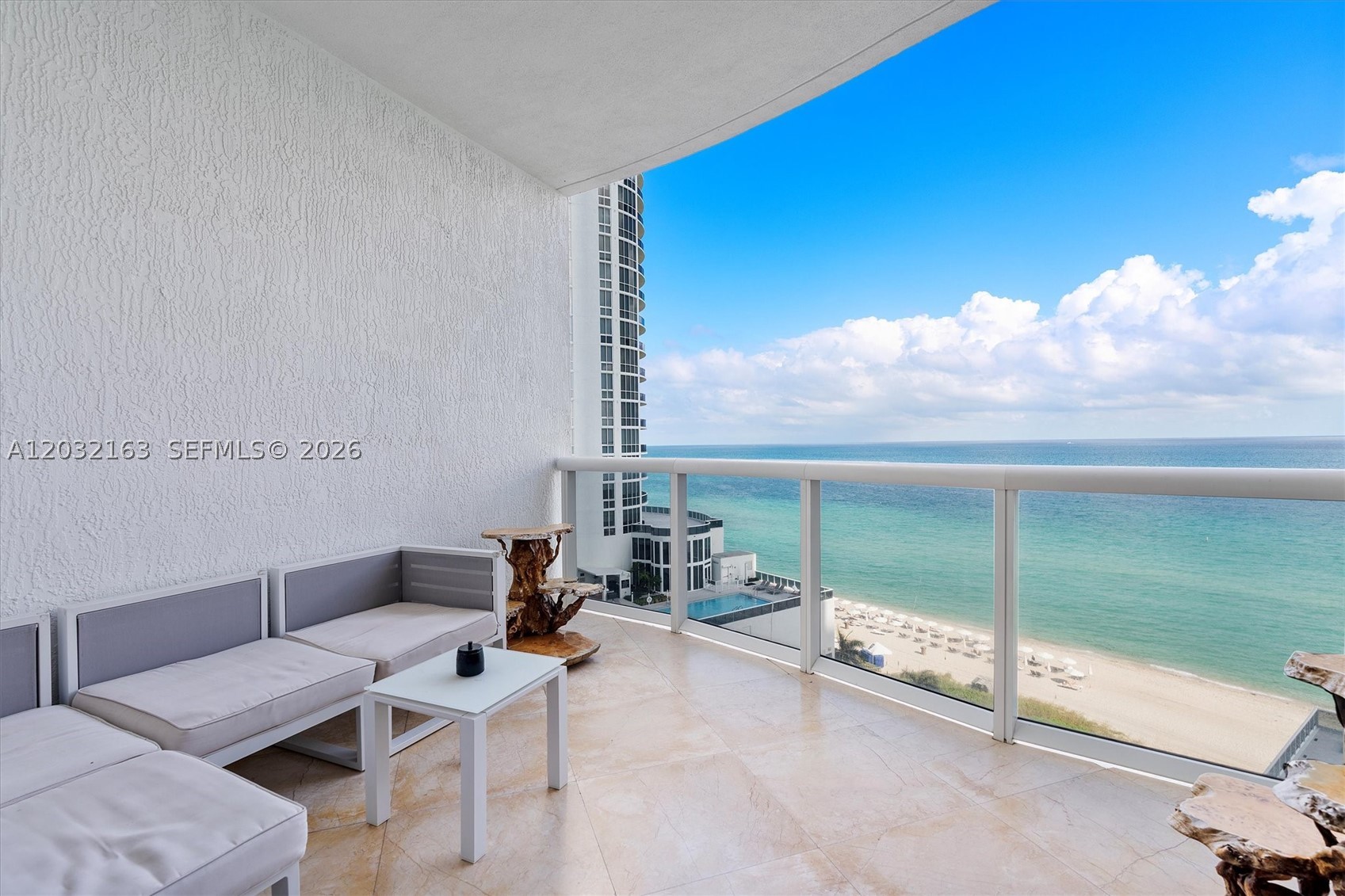 Stunning 3 bed / 3.5 bath direct ocean and Intracoastal residence with an east-to-west flow-through layout and 4 balconies to enjoy both sunrise and sunset. Professionally decorated, marble floors, split bedrooms, and an Italian kitchen with top-of-the-line appliances, wine cooler. Building offers resort-style amenities: state-of-the-art gym/spa, pool service, restaurant, business center, and concierge. Minutes to Bal Harbour Shops, Aventura Mall, and top dining.