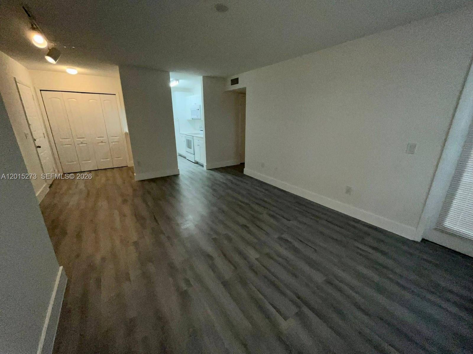 Instant cash-flow opportunity in Palm Aire Gardens! Tenant already in place in this beautifully updated 2-bedroom, 1-bath condo featuring a bright open-concept living/dining area, contemporary gray plank flooring throughout, a renovated galley kitchen with crisp white shaker cabinetry and stone-look counters, an updated bath, spacious bedrooms, and a covered private balcony. Set within a gated community offering multiple pools, spa, fitness center, tennis courts, clubhouse, laundry facilities, walking paths, and on-site management/security. Prime Palm Aire location near Florida’s Turnpike and minutes from golf, shopping, dining, colleges, parks, entertainment, and the beach. A turnkey portfolio addition with income in place from day one.