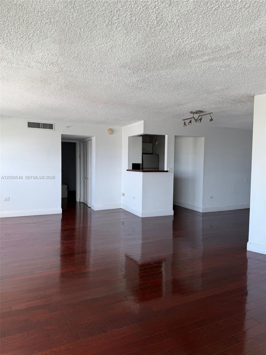 Positioned on the seventh floor, this fully remodeled and fully furnished 1-bedroom, 1-bathroom condo delivers a turn-key, high-performance living experience. The interior is engineered with beautiful wood flooring throughout, a streamlined kitchen featuring granite counters and stainless steel appliances, and a versatile den that showcases sweeping ocean views overlooking South Beach. Residents of this architecturally significant building command access to a premium suite of amenities, anchored by seamless valet parking. The property also features a private in-ground pool and highly accessible on-site laundry facilities for absolute convenience. Strategically located in the core of Miami Beach, directly across from the convention center, this prime location places you just blocks from the ocean, Lincoln Road, and the city's premier dining and entertainment districts. A high-caliber asset offering an unmatched lifestyle.