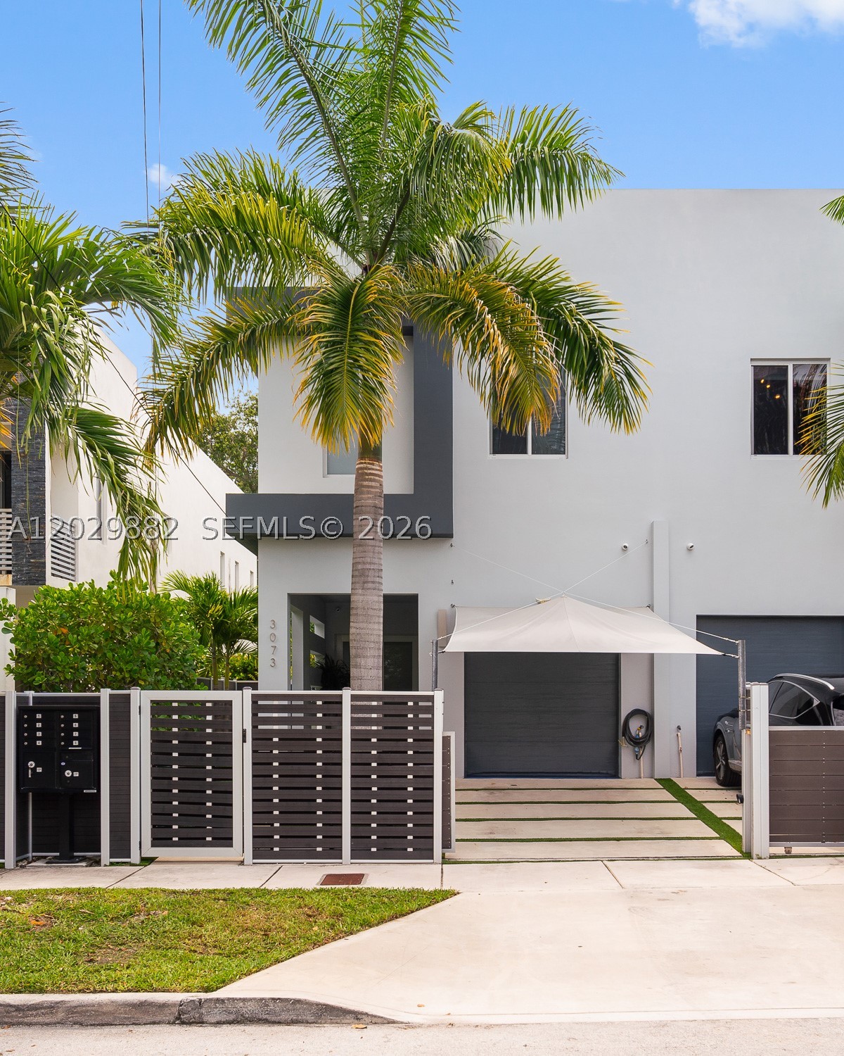 Modern Coconut Grove townhouse built in 2020, offering 3 bedrooms, 3.5 bathrooms, and 2,220 square feet of contemporary living space. Privately gated, this residence features full impact windows and doors, soaring 10+ foot ceilings, and an open-concept layout filled with natural light. A custom entertaining bar complete with a wine cooler, sink, and ice maker adds both style and functionality, while the private garage features epoxy flooring and custom built-in cabinetry.

The spacious kitchen flows seamlessly into the living and dining areas, creating an ideal setting for entertaining and everyday living. Upstairs, the primary suite offers a private balcony, generous closet space, and a beautifully appointed bath with dual vanities. Two additional bedrooms provide flexibility for guests, family, or a home office.

Enjoy year-round outdoor living with a private pool, lush tropical landscaping, and an outdoor gas grill with a built-in stovetop. Meticulously maintained, the home includes a whole-house HALO water filtration system, freshly painted interiors, and a recently painted exterior finished with premium waterproof paint.

 Ideally located near Grove Village, marinas, parks, top-rated schools, dining, and shopping, this is an exceptional opportunity to own a modern, move-in-ready townhouse in one of Miami's most sought-after neighborhoods.