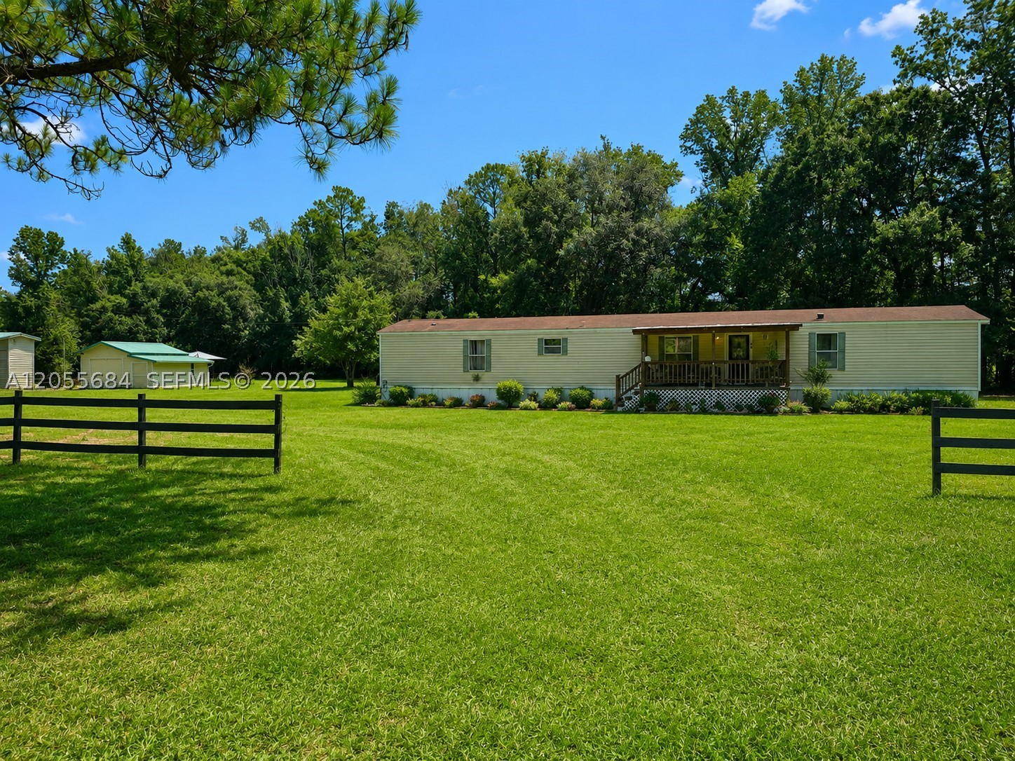 Virtually staged. Escape to the quiet charm of North Florida with this well-maintained 3-bedroom, 2-bath manufactured home situated on almost one acre off a paved road in Lake Butler. Conveniently located just minutes from Starke and approximately 40 minutes from Gainesville, this property offers the perfect balance of rural tranquility and easy access to shopping, dining, and everyday conveniences.
Designed for comfortable country living, the home features both a welcoming front deck and a spacious back deck, providing ideal spaces to relax, entertain, or enjoy the peaceful surroundings. The backyard is a private retreat, framed by mature trees and highlighted by a majestic oak tree that creates natural beauty and shade. A storage shed offers extra space for tools and equipment, while the chicken coop makes it easy to embrace a homesteading lifestyle.
This home has been professionally installed with HUD-approved anchors, making it eligible for FHA and VA financing. The septic system has been recently pumped, providing added peace of mind for the next owner. While the sellers currently use window air-conditioning units, the home is equipped with an existing central air-conditioning system and ductwork, offering the option to restore central cooling if desired.
Whether you're searching for your first home, a peaceful country retreat, or a place to enjoy a simpler lifestyle with room to spread out, this inviting property offers outstanding value in a beautiful rural setting.