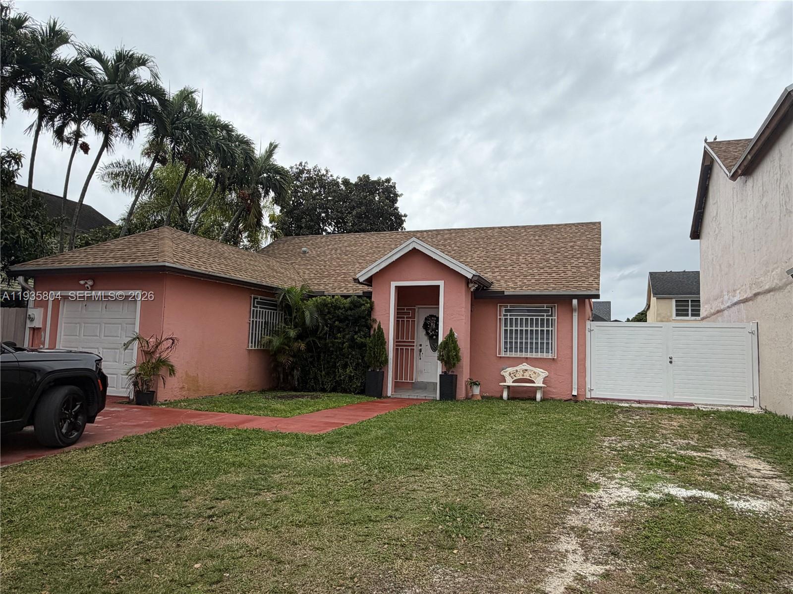 Welcome to your dream home in Homestead! This stunning single-family home boasts 3 bedrooms, 2 bathrooms, and a converted garage that adds extra living space for your family to enjoy. The modern kitchen features stainless steel appliances, perfect for whipping up delicious meals for loved ones. The sleek tile flooring throughout the home adds a touch of elegance and is easy to maintain. Imagine cozying up in the spacious living room with your loved ones or hosting gatherings in the open-concept dining area. The master bedroom offers a peaceful retreat with an en-suite bathroom, providing a private oasis for relaxation. Step outside to the backyard and envision summer barbecues, gardening, or simply enjoying the Florida sunshine. Located in a desirable neighborhood, this home is close to schools, parks, shopping, and dining options. Don't miss out on the opportunity to make this house your forever home. Schedule a showing today and start envisioning your future in this beautiful Homestead residence.