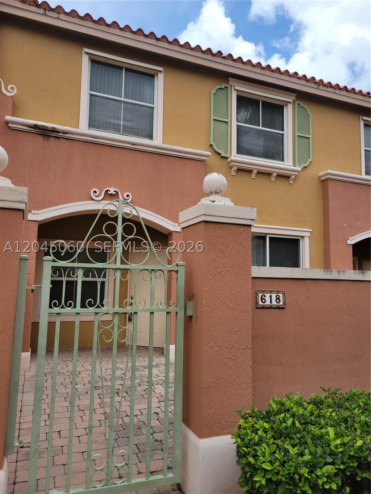 Freshly painted and comfortable 2 BR/2.5 bath townhouse in Pembroke Pines. Features newer appliances, ceramic tile downstairs, and wood laminate floors upstairs. Enjoy an enclosed patio/courtyard in front of the unit, perfect for a garden or BBQ. Situated in the secure, gated community of Hampton Isles, with easy walking access to the community pool and mailbox. Includes two assigned parking spaces and is conveniently close to shopping, schools, parks, and major highways.