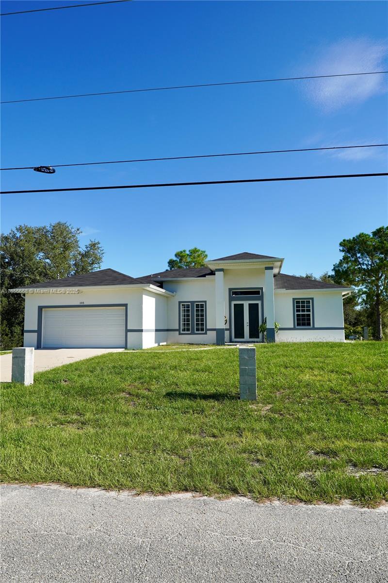 Discover modern elegance in this brand-new 4-bedroom, 3-bath home in a prime Lehigh Acres, FL location. Featuring impressive 15’ and 10’ ceilings, it offers an airy ambiance with spacious living areas flowing to a gourmet kitchen and dining space, perfect for gatherings. Custom shower tiling adds luxury, while the primary suite boasts a spa-like bath and walk-in closets. Three additional bedrooms provide flexibility for guests, office, or hobbies. A long driveway enhances curb appeal and offers ample parking, and the landscaped yard invites outdoor living. Conveniently close to schools, parks, amenities, and major routes, this home blends modern luxury with functional design. Schedule your showing today.