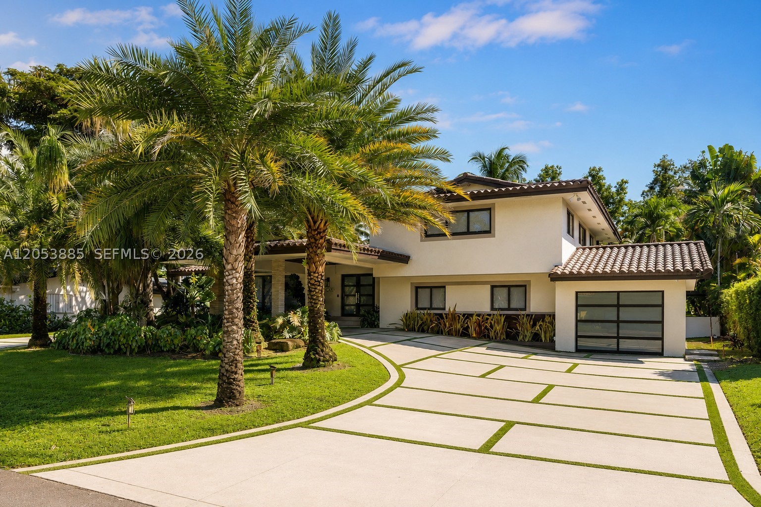 Luxury resort-style living overlooking the golf course in prestigious Country Club of Miami Estates. This beautifully renovated 4-bedroom, 3-bath tri-level residence combines elegant design with exceptional indoor-outdoor living. The chef's kitchen features paneled Jenn-Air appliances, quartz countertops, abundant cabinetry, and an oversized island that opens seamlessly to the living and dining areas with an illuminated glass wine display. The spacious primary suite offers a spa-inspired bathroom with a soaking tub, oversized glass shower, and dual vanities. The spectacular lower-level entertainment room is designed for unforgettable gatherings, complete with a custom full bar, theater area, and cabana bath. Upstairs you'll find three spacious bedrooms, including one with a private balcony overlooking the golf course, and a beautifully updated bathroom. Outdoors, enjoy a heated pool, separate spa, expansive teak deck, and panoramic golf course views. Additional features include impact windows and doors, beautifully updated landscaping, and a 2016 roof and A/C. Located within the exclusive 24-hour guard-gated community of Country Club of Miami Estates with roving security patrol. A rare opportunity to own a move-in-ready luxury home in one of Miami-Dade's most sought-after private communities.