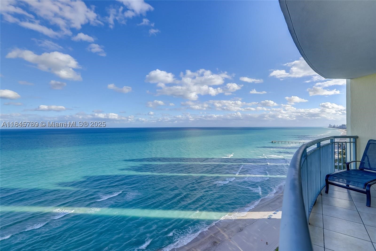 Absolutely unmatched direct ocean views from every room — a rare opportunity at this price point. Perched on a Lower Penthouse level, this spacious split floor plan offers sunrise views over the Atlantic and an open, airy layout designed to bring the beach lifestyle into everyday living. The primary suite features a large bath with separate tub and shower, and in-unit washer and dryer for convenience. Enjoy resort-style amenities: pool and beach service, valet, concierge, fitness center, spa, salon, business center, and indoor-outdoor dining. Condo fee includes electricity, water, cable, and internet. Opportunities like this — direct ocean views at this level and price point — are almost impossible to find.