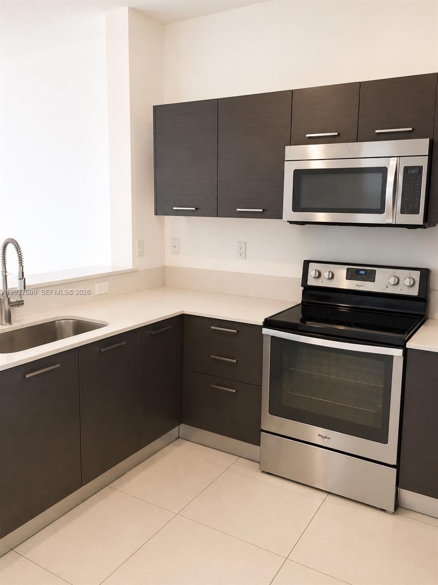 Modern and spacious 3-bedroom, 2.5-bath townhouse located in the desirable Cassa at Georgetown community in Lauderhill. Built in 2014, this move-in ready home features an open-concept layout with porcelain tile floors on the first level, carpet upstairs, high ceilings, and abundant natural light throughout. Stylish kitchen with European-style cabinetry, quartz countertops, and stainless steel appliances. Spacious bedrooms, updated bathrooms, full-size washer and dryer, and attached one-car garage with additional parking spaces.