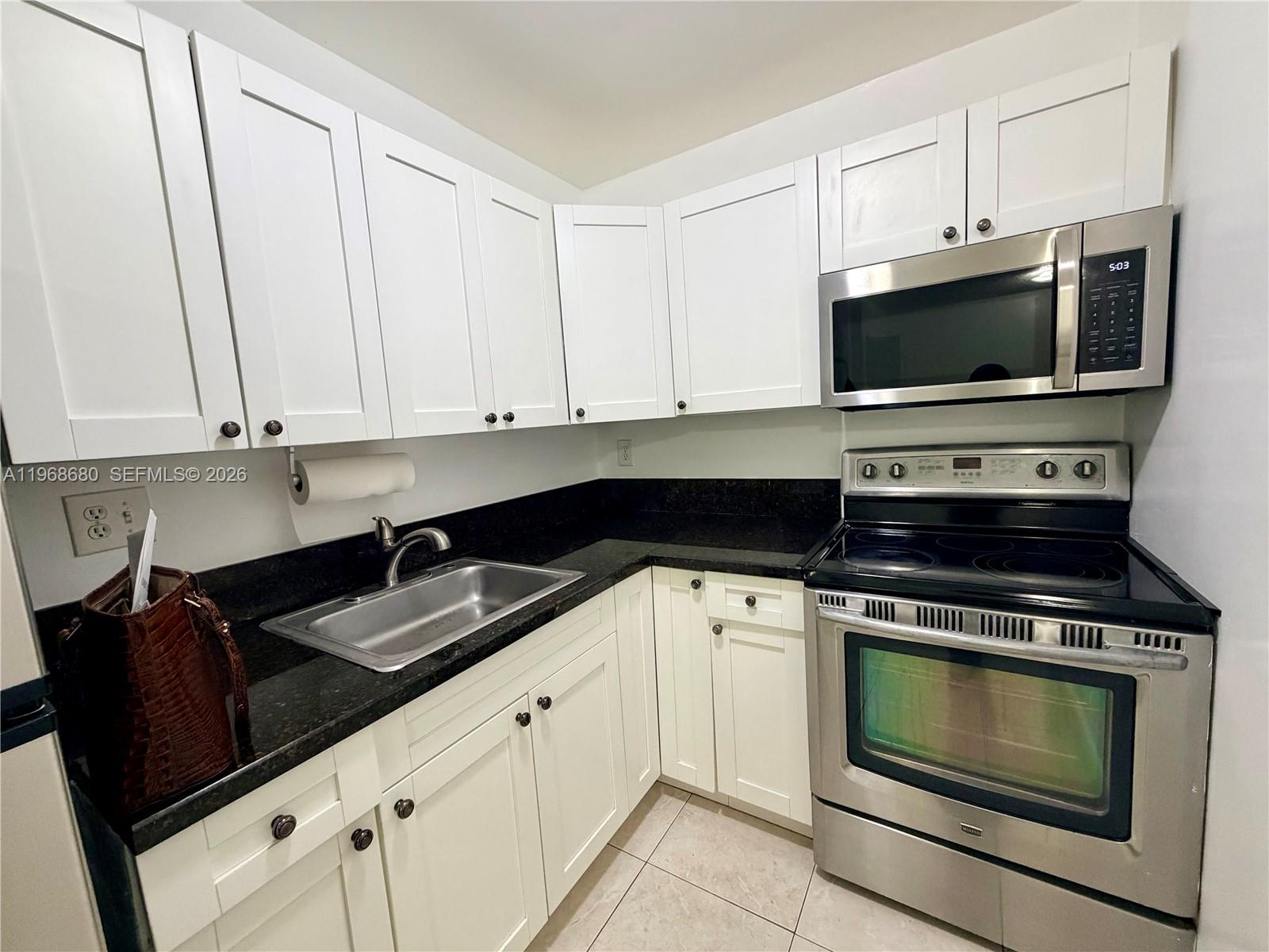 1st-floor apartment with balcony, all tile, large closet, freshly painted, great location, and excellent community at Palm Spring in Sabal Pointe Condominium. Water included—quick approval HOA on site, 1 bedroom / 1 bathroom.