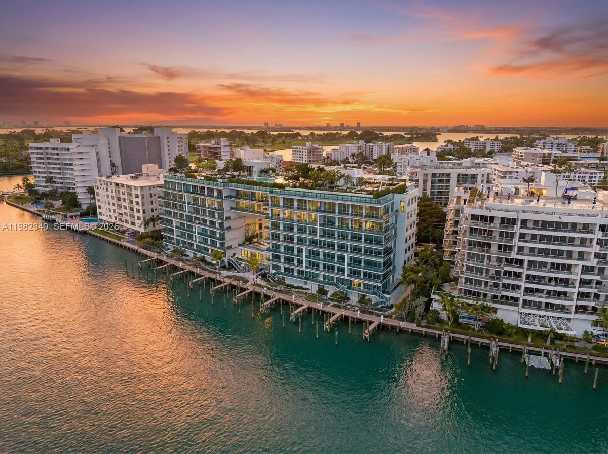Elegant residence at La Baia South in the heart of Bay Harbor Islands. This expansive 2BD/2.5BA home offers approx. 1,861 SqFt of refined living with 9’ ceilings, floor-to-ceiling impact glass, and a spacious private terrace. The building enjoys sweeping views of Biscayne Bay, the Atlantic Ocean, Bal Harbour, Miami Beach, and downtown Miami.

Features include wide-plank European wood floors, open living/dining, and a chef’s kitchen with custom imported Italian Snaidero cabinetry and a full Miele appliance package, including electric cooktop, wall oven, dishwasher, refrigerator, and microwave, plus quartz countertops. Spa-style marble baths.

Fully furnished and never lived in, this turnkey residence is move-in ready. Walk to the beach, dining, and Bal Harbour Shops. Amenities include rooftop pool, fitness center, concierge, valet (2), storage, and private marina with 20 slips plus pick-up/drop-off.