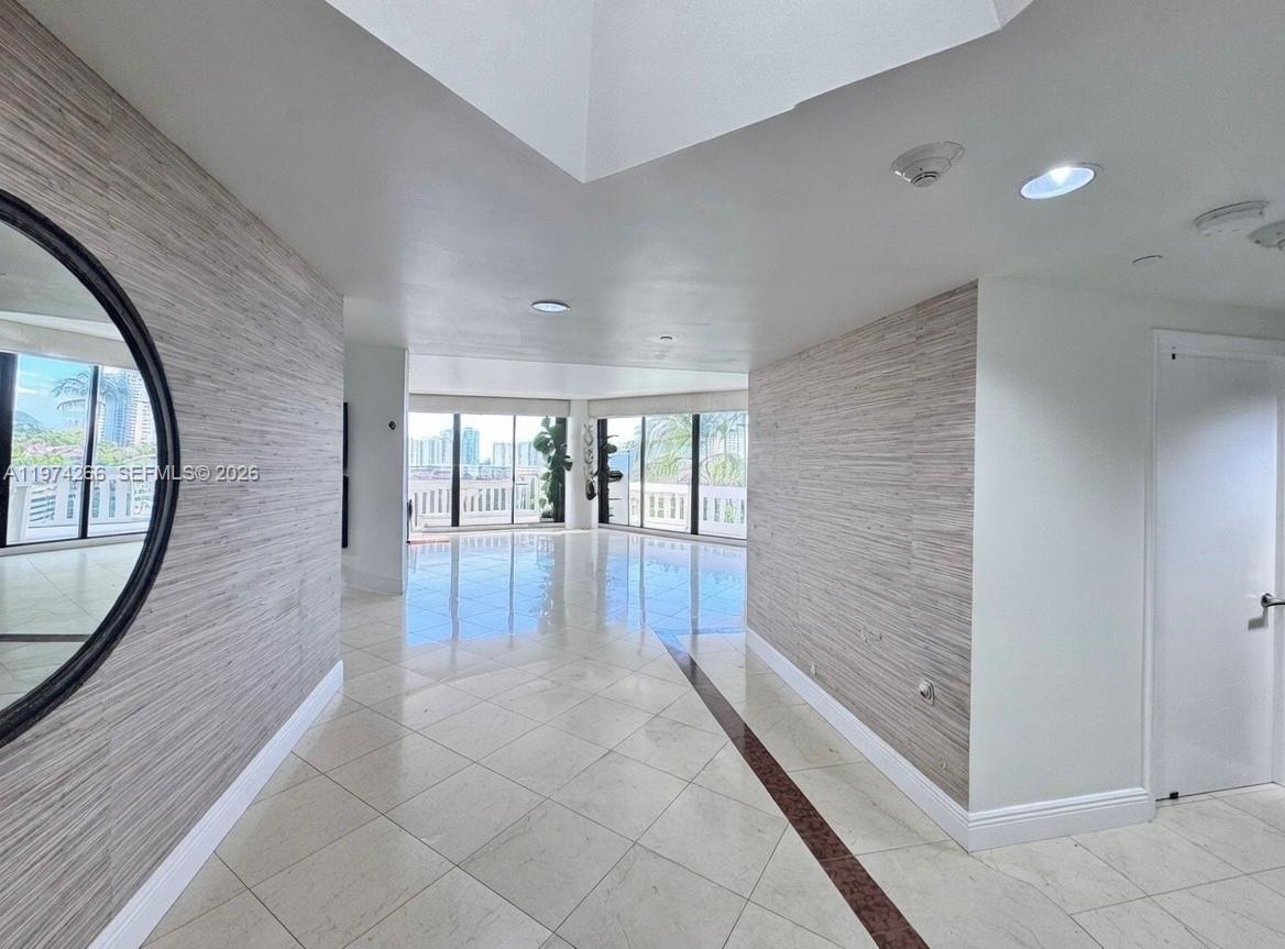 Welcome to Unit 606 at Williams Island, a refined 3-bedroom, 2.5-bath residence perfectly positioned at a desirable mid-level elevation. High enough to capture privacy and open views, yet intimately connected to the lush grounds and sparkling waterways below, this home offers the best of both perspectives.
The thoughtfully designed layout features expansive living and dining areas that flow effortlessly onto a private terrace, an elegant setting for morning coffee, sunset cocktails, or relaxed entertaining. Abundant natural light enhances the interiors, creating a bright, airy ambiance throughout. A well-planned split-bedroom design ensures comfort and discretion, ideal for both everyday living and hosting guests.
The primary suite serves as a serene retreat, complete with generous closet space and a spa-inspired bath. Two additional bedrooms offer flexibility for family, guests, or a sophisticated home office.
Ownership here extends far beyond the walls of the residence. Residents of Williams Island enjoy a full-service, resort-caliber lifestyle including a private marina, tennis club, spa, state-of-the-art fitness center, on-site dining, and 24-hour security, all within one of South Florida’s most established and prestigious waterfront communities.
