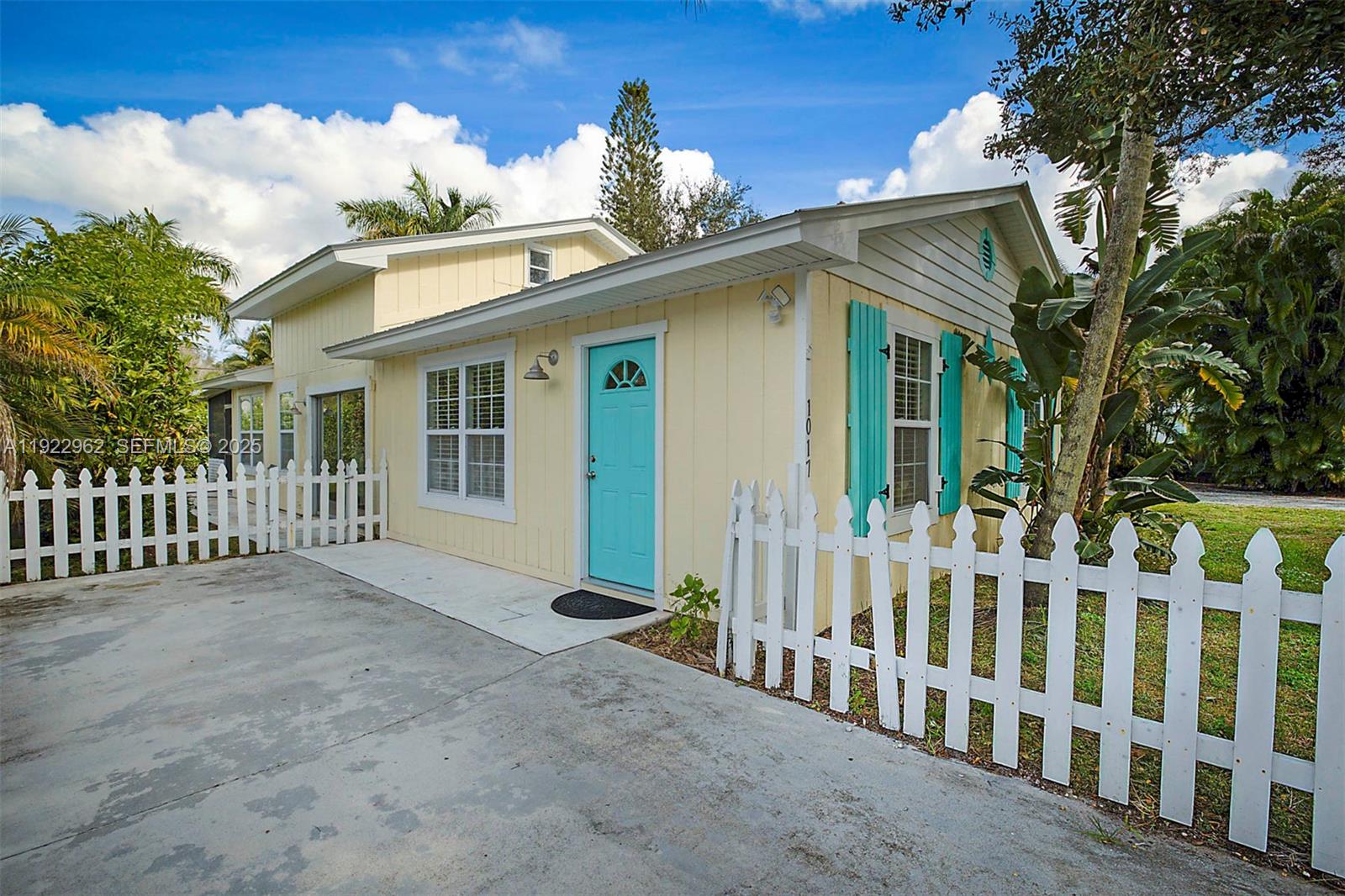 Discover the charm of this vibrant 3-bedroom, 1.5-bathroom, two-story Key West–style home perfectly situated just minutes from the beach. Bursting with character, this tropical escape sits on a rare double lot, offering extra privacy, space, and endless possibilities- including plenty of room to park a boat. Even better, Charlie Leighton Park is located just across the street, providing a convenient public boat launch for effortless days on the water. Step inside to find beautiful Mexican tile floors throughout the main living areas, adding warmth and coastal flair. The updated kitchen features brand-new appliances, making everyday living and entertaining a breeze. Natural light pours into every room, enhancing the home’s welcoming, airy feel. Your private oasis awaits out back with a sparkling pool, lush landscaping, and plenty of room for lounging, grilling, and enjoying the Florida sunshine. With no HOA, you’ll have the freedom to personalize, rent, or simply relax without restrictions. Whether you're looking for a vacation getaway, investment property, or full-time residence, this Key West–inspired beauty delivers the best of easy, breezy coastal living-with unbeatable access to both beach and boating.