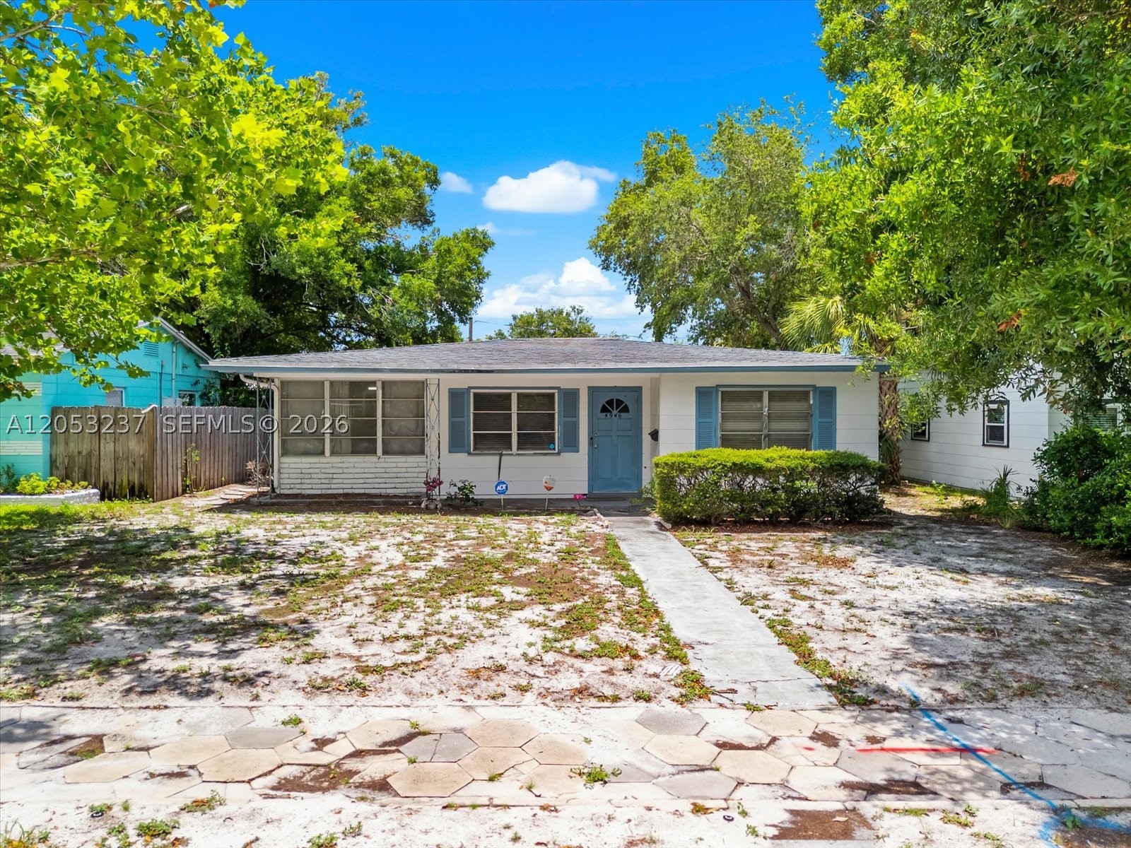 Opportunity awaits in this charming St. Petersburg home! Situated on a spacious lot, this 2-bedroom, 1-bath residence offers a great potential. The kitchen features stainless steel appliances, ample cabinetry, generous counter space, and a breakfast bar overlooking the living area. The home has been updated over the years but could benefit from a little TLC. Enjoy a large fenced backyard with plenty of room for entertaining, gardening, or future expansion, along with a covered carport, storage shed, and mature shade trees. Conveniently located just minutes from downtown St. Petersburg, Gulf beaches, shopping, dining, parks, and major roadways, this property offers endless possibilities in a desirable location.