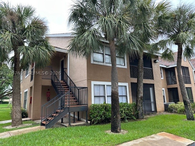 Beautiful Move-In ready, freshly painted interior 2 bedroom, 2 bath condo. Spacious kitchen with espresso tone cabinets, granite counter tops, breakfast bar area and full appliances. Neutral tone tile floors throughout living area and wood floors in bedrooms. Large master bedroom with walk in closet. Open balcony area to enjoy the upcoming fall weather. This unit comes complete with an interior laundry room that includes a washer and dryer. Located in the wonderful community of the Hammocks, close to A rated schools, transportation, shopping, restaurants and so much more! Pet friendly community with restrictions.