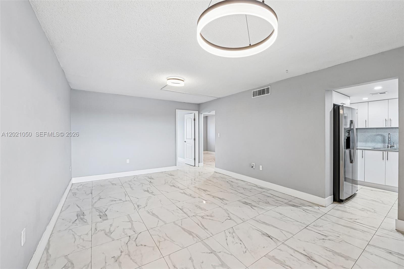 Excellent opportunity to own a spacious and well-maintained 5th-floor condo flat in the highly sought-after King's Castle community of Hialeah! This move-in ready unit features a bright, single-level layout with beautiful ceramic tile throughout the main living areas and modern wood-style laminate flooring in the bedrooms. Impact windows and an updated kitchen boasts stainless steel appliances, a French-door refrigerator, and an over-the-range microwave. Relax on your private, fully screened-in balcony overlooking the community. Secure building with elevator access and gated/fenced parking. The superbly inclusive monthly maintenance fee covers hot/cold water, trash, sewer, and building insurance. Enjoy fantastic community amenities including a sparkling pool and clubhouse. Conveniently located near major highways, shopping, and dining. Ideal for primary homeowners or investors!