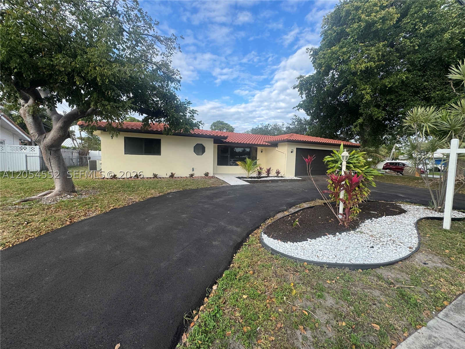 One or more photo(s) was virtually staged. Welcome to this beautifully updated 2-bedroom, 2-bathroom home with a 2-car garage and circular driveway, located in the highly desirable Cove neighborhood of Deerfield Beach. Situated on an oversized corner lot, this home is just a short distance to The Cove Shopping Center, marina, sand, ocean, restaurants, and shops.The home features all hurricane impact windows and doors, 2018 roof, freshly painted interior and exterior, tile floors in living and dining areas, and laminate flooring in the bedrooms. Updated kitchen with Corian countertops and remodeled bathrooms with upgraded finishes make this home move-in ready.
Prime corner-lot location, minutes from the beach—ideal for investors orshort-term rentals with No HOA.