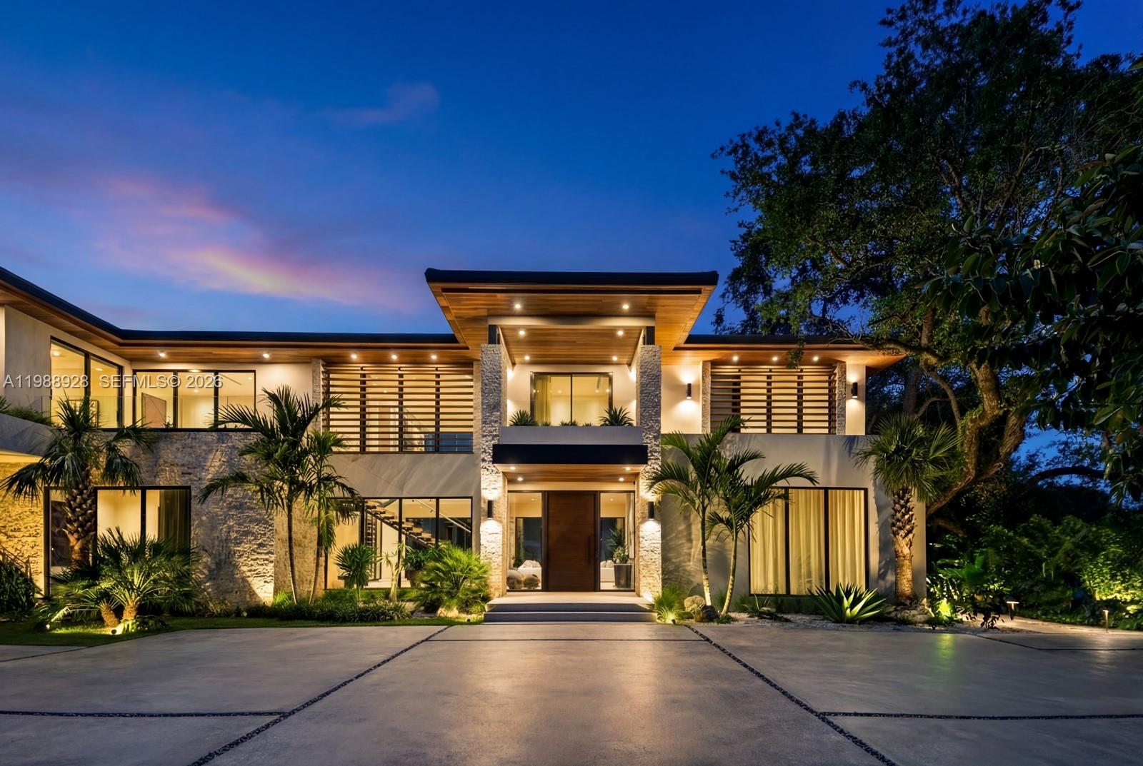 Situated on a rare builder’s acre in the coveted Ponce Davis enclave, this brand-new tropical modern estate offers exceptional privacy, scale & resort-style living. Surrounded by mature bamboo & lush landscaping, the home spans over 10,000SF w/ soaring ceilings and a warm, organic palette of premium natural materials throughout. Expansive glass doors open to 1,800SF of covered terraces overlooking a heated saltwater pool & private hardcourt tennis court. The residence is anchored by a showpiece Italian chef’s kitchen featuring dual islands & top-tier appliances. Fully turnkey & just completed, the home showcases bespoke millwork, fully built-out closets, and designer window treatments. Additional features incl a detached guest house w/ gym, smart home integration, and a 3-car garage—creating a private compound ideal for both grand entertaining and everyday living.