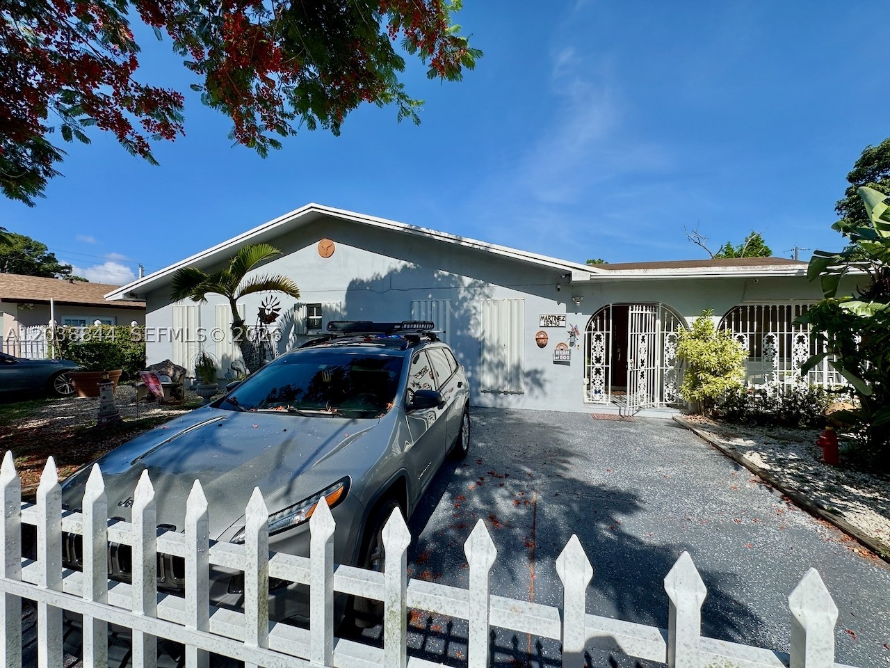 Excellent opportunity for both end-users & investors. Please note: the home next door is also available for sale (A12038853).
Located in a quiet, family-oriented neighborhood between St. Thomas University and Florida Memorial University, this versatile property offers flexible living options and strong potential. The home is currently configured with a private 1-BR/1-BA efficiency featuring a kitchenette, family room, separate entry, and private outdoor space. This area can easily be converted back to the original layout. A 2024 mini-split AC unit services the efficiency area.
The main entry opens to an expansive living/family room, followed by a dining area and kitchen with café-style breakfast seating and stainless steel appliances. An additional large rear family room provides excellent space for entertaining. The primary bedroom includes a bo-nus room, currently used as an additional bedroom, while the secondary bedroom is generously sized. The home also features a laundry room, 4-year-old 4-ton AC unit and 3-year old 2-ton AC. Flat roof roof replaced 4 years ago. Septic system was just cleaned and tested in May ‘26.
Outside, the property brings a country feel to the city with an outdoor kitchen, huge lychee tree, lush vegetation, 24’-wide above-ground pool, bird cages, and a full-sized storage shed w/electric. Fully fenced, including sliding front gates for secure parking.