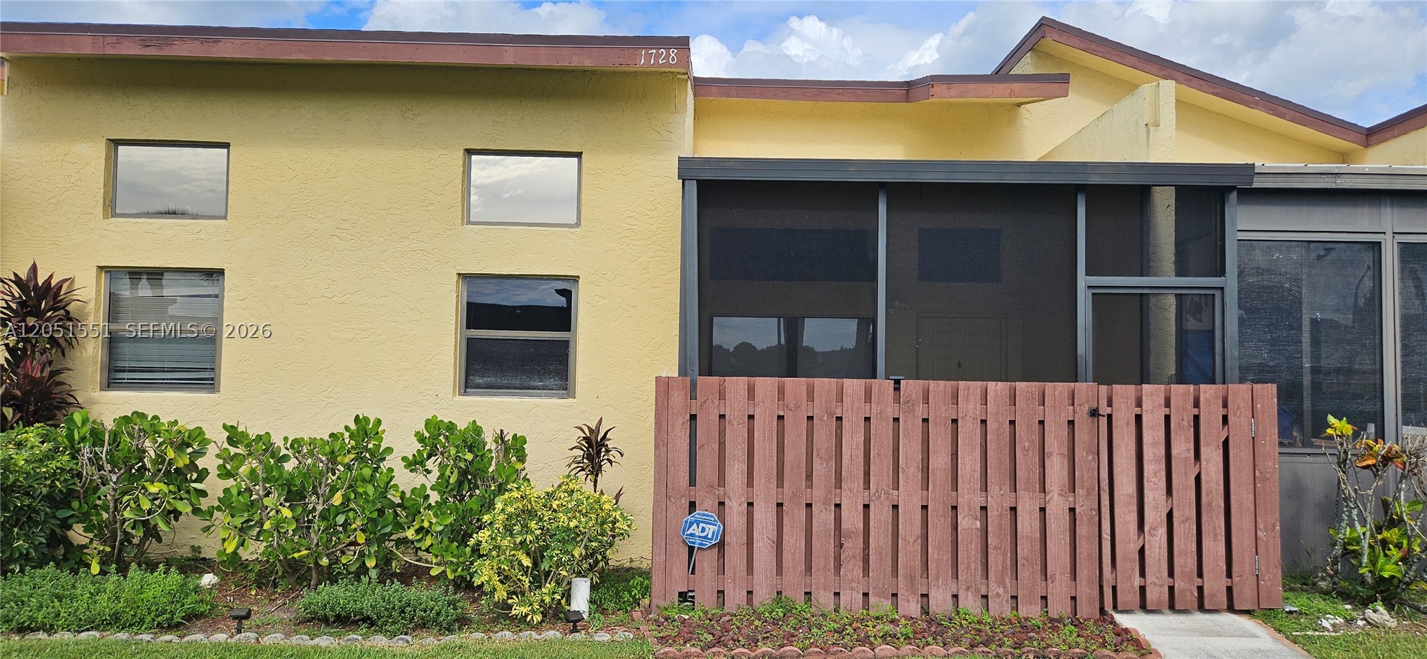 Enjoy peaceful lake views and an airy, light-filled interior in this 2-bed, 2-bath condo nestled within The Savannahs in Fort Pierce. Soaring vaulted ceilings and expansive windows create an inviting sense of openness, while warm wood-look flooring flows throughout the main living areas for a clean, cohesive look. The primary suite overlooks the lake and includes a large walk-in closet, dual-sink vanity, and en-suite bath. A guest bedroom with built-in shelving and an adjacent full bath provides excellent flexibility for visitors, a home office, or hobby space. An in-unit washer and dryer adds everyday convenience. Resort-style amenities include a clubhouse, swimming pool, fitness center, tennis and pickleball courts, winding paths, and beautifully maintained grounds. Ideally situated near shopping, dining, and everyday conveniences, the community also offers exceptional proximity to major healthcare providers, including HCA Florida Lawnwood Hospital, as well as Indian River State College and the Florida State University College of Medicine. Just a short drive from historic downtown Fort Pierce, waterfront attractions, and Atlantic beaches, this home offers an ideal combination of comfort, convenience, and the relaxed Treasure Coast lifestyle.