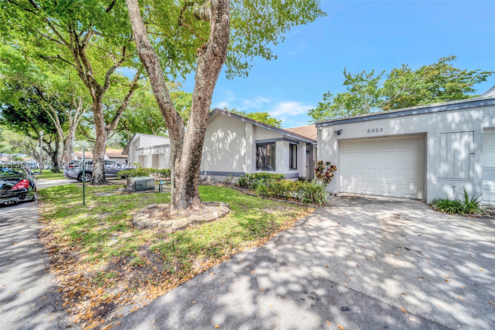 Discover the potential of this charming lakefront villa nestled within The Villas at the Gate in Tamarac. Offering approximately 1,625 square feet of living space, this single-story residence features 3 bedrooms, 2 bathrooms, and a one-car garage, all situated on a peaceful interior waterfront lot.

The thoughtfully designed floor plan provides spacious living areas filled with natural light, while large rear windows showcase serene lake views. Step outside to the screened patio, the perfect setting for relaxing, entertaining, or enjoying South Florida's year-round outdoor lifestyle.

Maintained in average condition, the home presents an excellent opportunity for buyers to add their personal touch and create their ideal living space. Conveniently located near major highways, shopping centers, restaurants, and everyday conveniences, the property combines comfort, location, and value.

Set within a well-established community of villas and townhome-style residences, this home is an attractive option for a buyer to have a single family home feel while enjoying the perks of being a villa. Roof is covered by the association, which is a great feature.
