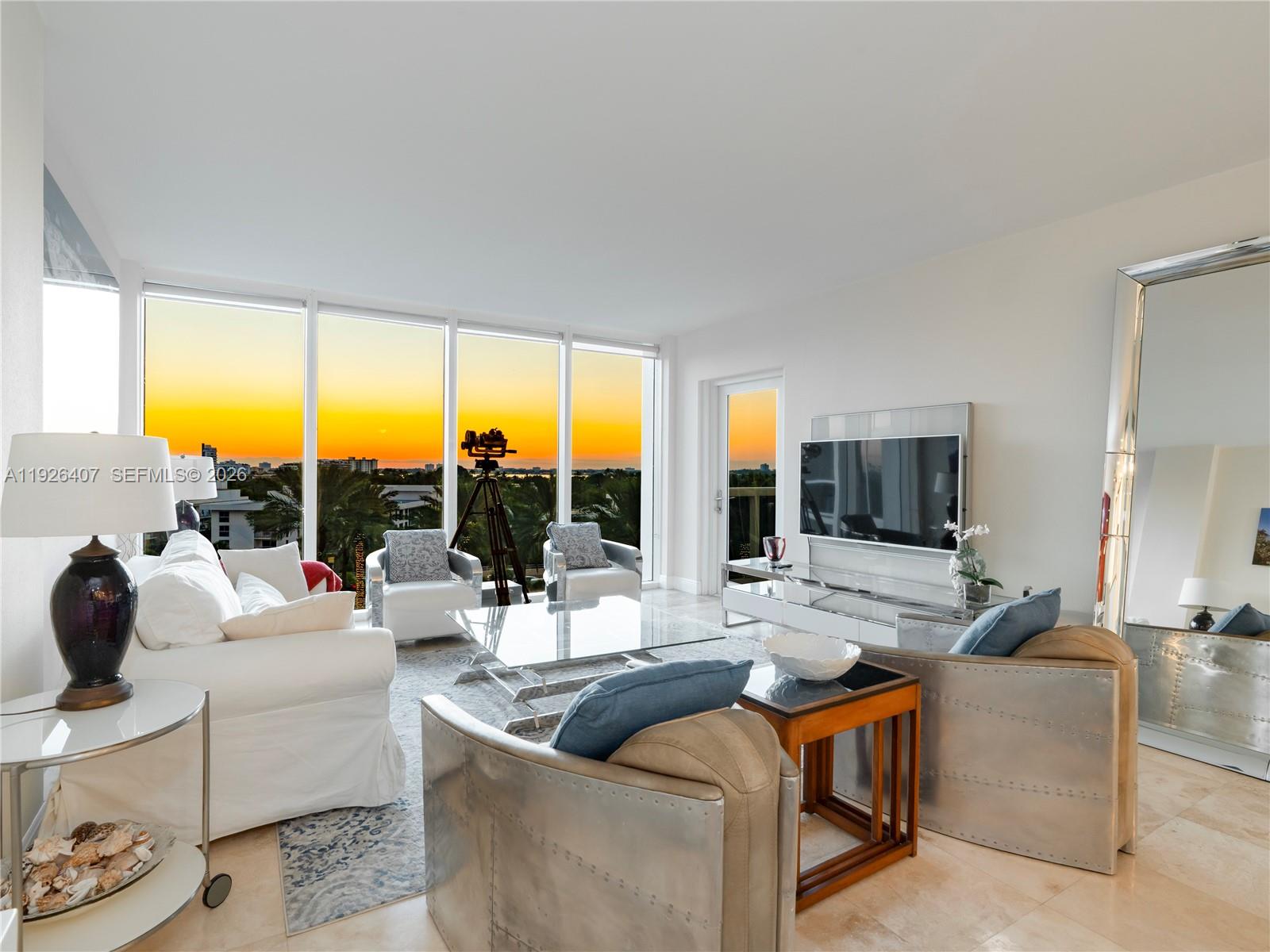 Step into this exquisite one bedroom unit you are immediately greeted by a breathtaking Sunset view that envelopes the space in warm golden Hues. The open concept, living area seamlessly flows into large windows that frame the stunning panorama creating an atmosphere filled with natural light. Harbour House is a full service building located in Bal Harbour in between the Ritz Carlton and future site of Rivage. Prime location ocean front location.