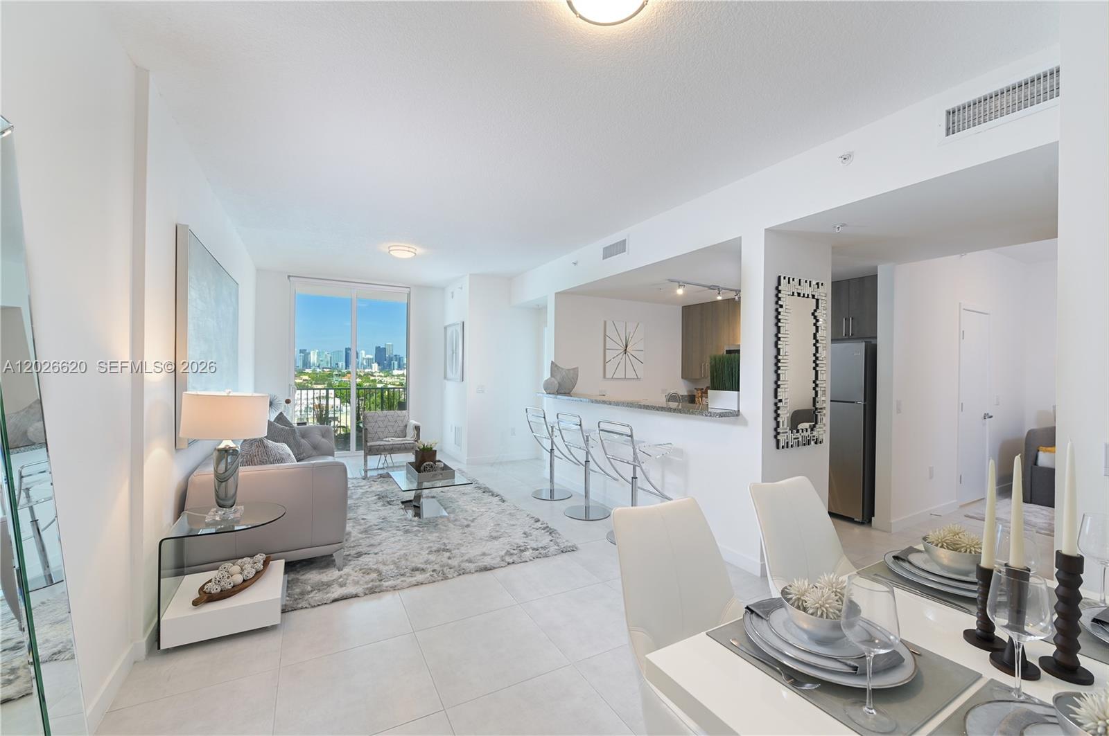 Step into modern living with this sleek 1 Bedroom + Den, 2 Bathroom residence spanning 986 sq. ft. This unit features 9ft ceilings, stainless steel appliances, granite countertops, in-unit washer & dryer, and a private balcony. The versatile 8x11 Den is perfect for a home office, guest room, or flex space. Built in 2019, this boutique 72-unit building offers a 24/7 fitness center and assigned parking (option for a second spot). Centrally located in Little Havana, just 10 - 15 minutes from Coral Gables, Downtown, Brickell, or Wynwood. $500.00 security deposit. Don’t miss the chance to make this stylish apartment your new home!