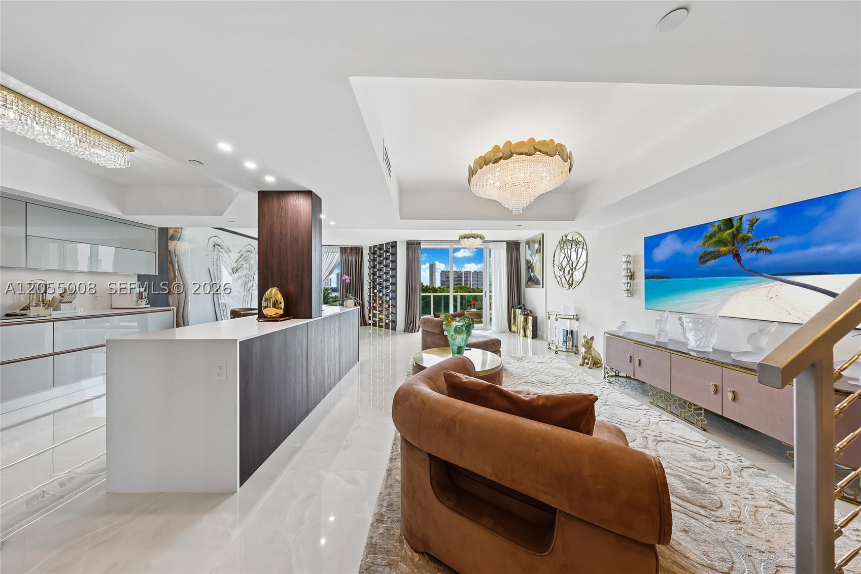Step into a world of curated, bespoke elegance. This 2 Bedroom 2 Den residence offers a rare, fully realized turnkey experience where no expense was spared, and no detail overlooked. This is a masterpiece of modern European design, featuring a sleek Mia Cucina kitchen with motorized hinges, top brand appliances, and abundant storage, custom fit Boca do Lobo vanities, Serip lighting features, marble wall accents, large slate porcelain floors, custom drapes, and much more. Finely selected Roberto Cavalli and Visionnaire furniture. Rare two-story condo layout, emphasized by a captivating full length Serip chandelier. The fifth floor ideally preserves an incredible view, and offers the distinct advantage of easy stair accessibility. Enjoy a premier location, steps from local houses of worship, minutes to Aventura Mall and upscale shopping, gourmet grocers like Plum and Fresh Market, fabulous dining, and a short drive to the beaches. Enjoy unobstructed waterfront views of the Intracoastal, Privé island, and the Sunny Isles skyline. The versatile floor plan consists of two main bedrooms with lavish ensuite baths, plus additional private rooms—ideal for home office or in-home wellness, and extra guest room. A rare opportunity to capture a Diamond. Peninsula 2 offers 5-star resort amenities that set a gold standard for Aventura Real Estate: two fitness centers, two complete spas, multiple pools, tennis courts, cafe, caring Staff with 24/7 concierge, security, and valet. Tour Today.