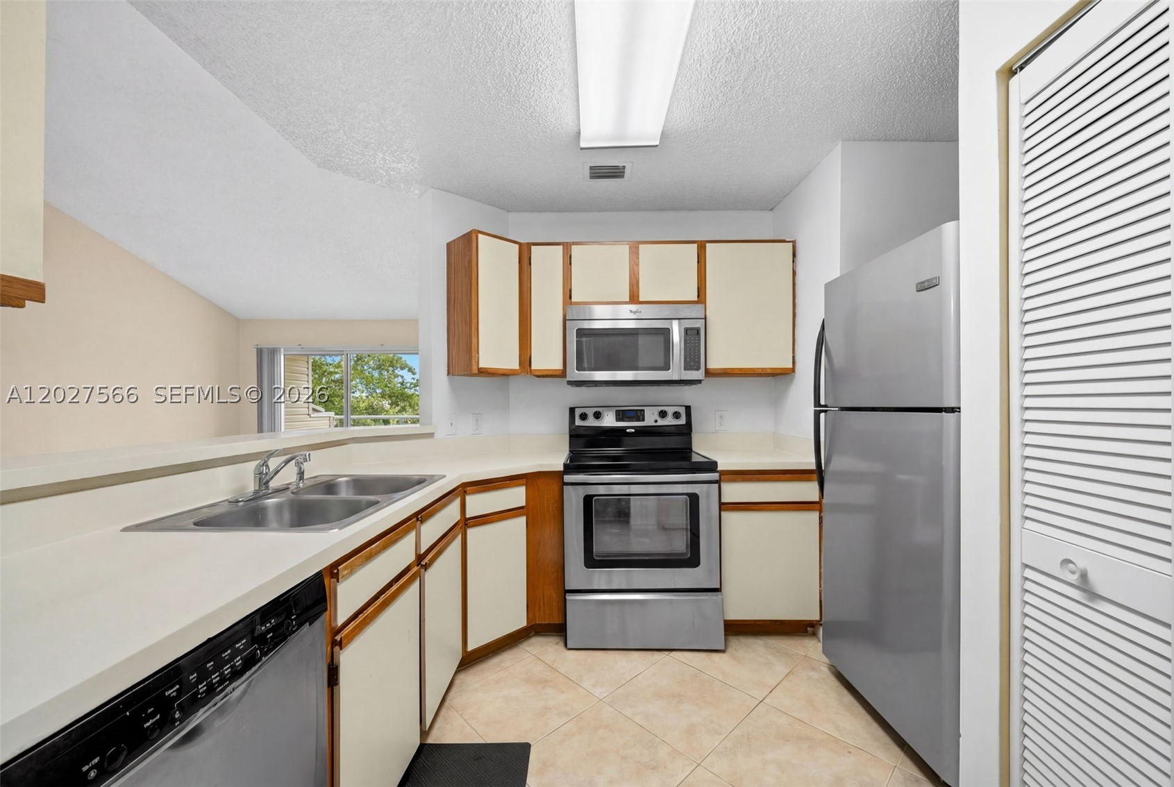 Beautifully updated lakefront condo in a Key West-style gated community on a scenic 23-acre lake. Enjoy stunning water views from every room, vaulted ceilings, tile flooring, stainless steel appliances, and an open balcony perfect for relaxing. Conveniently located near major highways, Fort Lauderdale Airport, Lauderdale-by-the-Sea beaches, shopping, dining, and entertainment. Amenities include a lakeside pool, clubhouse, fitness center, tennis, basketball, and walking/jogging paths. Pet-friendly —ideal for investors, first-time buyers, or a vacation home. Must see!  SEE BROKER'S REMARK