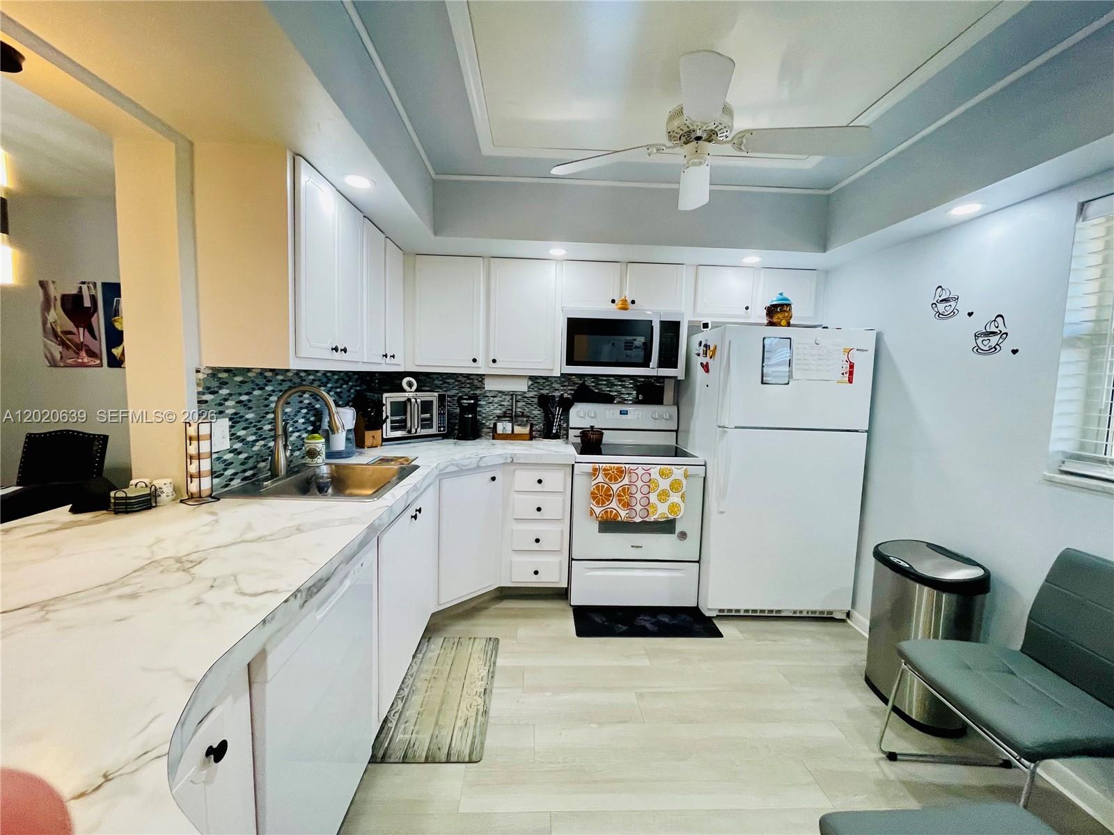 Tucked away on the fourth floor of the welcoming 55+ community of Village Royale, this beautifully updated corner residence feels like a peaceful retreat the moment you walk through the door. Morning sunlight pours through the balcony filling the open spaces with warmth and creating the perfect setting for quiet mornings or visits with family and friends.

At the heart of the home, the thoughtfully renovated kitchen blends beautifully into the dining and living areas, making everyday living feel easy and connected. Just beyond, the private balcony invites you to unwind with tranquil garden and community views while enjoying the gentle South Florida breeze.

The spacious primary suite offers a cozy escape with generous closet space and direct access to a tastefully updated bathroom. booth bedrooms come with impact windows, and a second full bath provides comfort and convenience for guests.

Village Royale is known for its vibrant yet relaxed lifestyle, featuring two clubhouses, heated pools, fitness center, pickleball, tennis, social activities, movie nights, and so much more. Conveniently located, close to I-95, just minutes from beaches, shopping, and dining in Boynton Beach, this home offers more than a place to live it offers a lifestyle to enjoy. Come visit and see why so many love calling Village Royale home. Association approval required. Credit score of 700.