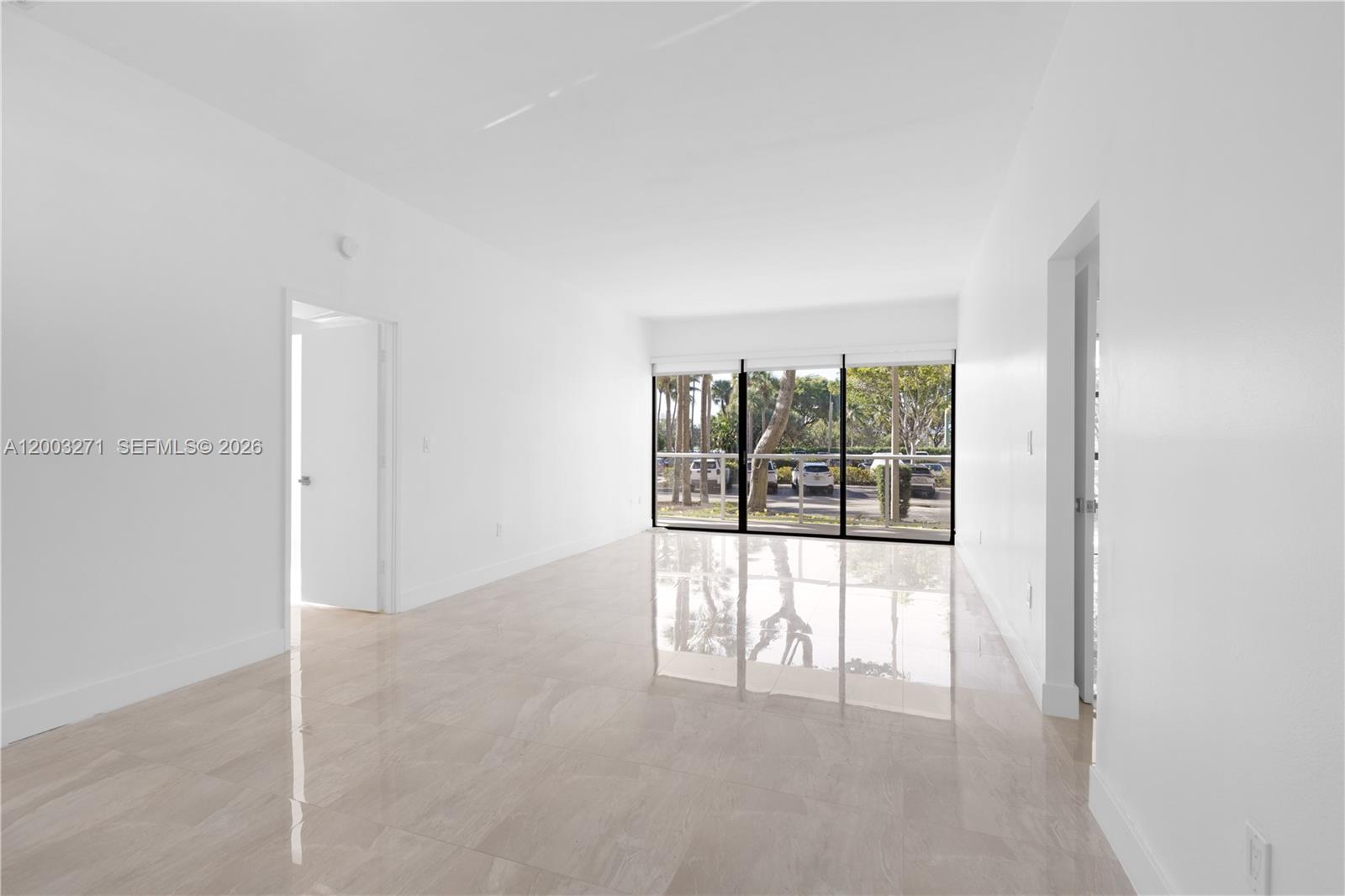 Beautifully renovated 2-bedroom, 2-bathroom first-floor condo in the heart of Aventura, located at Flamenco Condominium, directly across from the prestigious Turnberry Golf Course. This residence offers the comfort and feel of a private home with the convenience of condo living, featuring high ceilings, a spacious open layout, and abundant natural light. The unit has been fully renovated with permits, with electrical and plumbing systems brought up to current code. The modern kitchen showcases white shaker cabinetry, quartz countertops, designer backsplash, recessed lighting, and all brand-new stainless steel appliances. Elegant porcelain flooring runs throughout, complemented by smooth ceilings and a clean, contemporary color palette. Both bathrooms have been tastefully remodeled with modern vanities, frameless glass showers, and refined finishes. The generously sized bedrooms offer excellent closet space and a bright, airy atmosphere. Enjoy a prime Aventura lifestyle just minutes from world-class shopping and dining at Aventura Mall, along with beaches, parks, and major roadways. Move-in ready, impeccably maintained, and thoughtfully upgraded—this is a rare opportunity to own a turnkey, first-floor residence in one of Aventura’s most desirable communities.