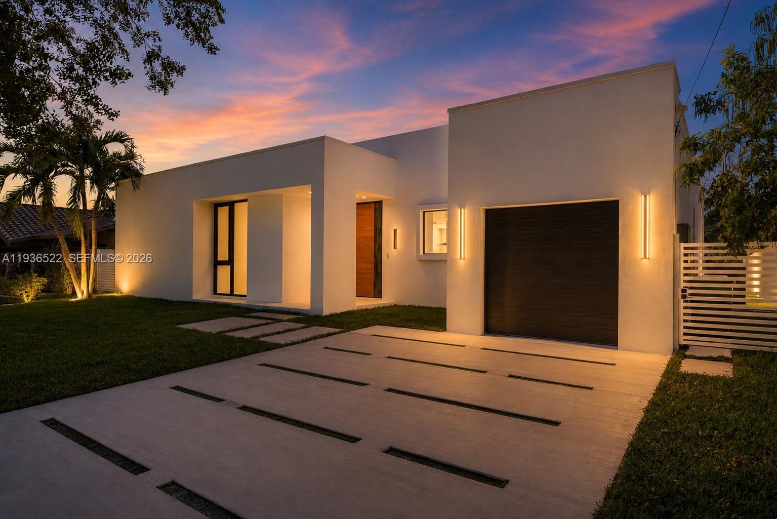 Experience modern waterfront living in this stunning 4-bedroom, 3.5-bath contemporary home located in the exclusive, guard-gated community of Keystone Point. This beautifully designed residence was extensively rebuilt and renovated to modern standards while preserving portions of the original structure.  The home features soaring ceilings, an open-concept layout, a chef’s kitchen with premium finishes, and built-out closets throughout. Seamless indoor-outdoor flow leads to a resort-style backyard with a sleek pool, updated dock, and a spacious open patio perfect for entertaining. With 75 feet of waterfront and direct ocean access with no fixed bridges, this home is a boater’s dream. Every detail reflects luxury, comfort, and the elegance of South Florida living. Just minutes from Bal Harbour Shops and 30 minutes from both Miami and Fort Lauderdale airports. Move-in ready and designed for those who expect more from life on the water.