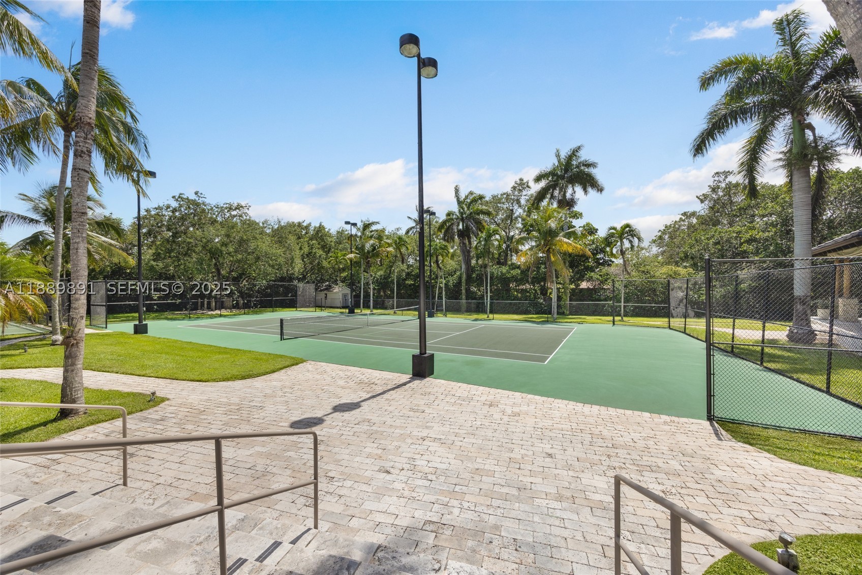 A rare offering in a rapidly evolving enclave, indulge in a private Miami resort lifestyle at Farmer Road Estate, a gated 2.16-acre sanctuary in north Palmetto Bay, minutes from Pinecrest. Designed for gathering, recreation, and multigenerational living, this estate offers the land, scale, and setting that are increasingly difficult to recreate. Elegant interiors showcase intricate woodwork and dramatic arches, while expansive terraces, and lighted tennis and basketball courts create a destination experience where a long weekend feels like a getaway. Amenities include a billiard room, sauna, gym, kids' loft, outdoor bar, BBQ gazebo, and a private 3-bedroom guest wing. Andersen windows and doors, a Viking kitchen, and a 2025 metal roof complete this exceptional legacy property.