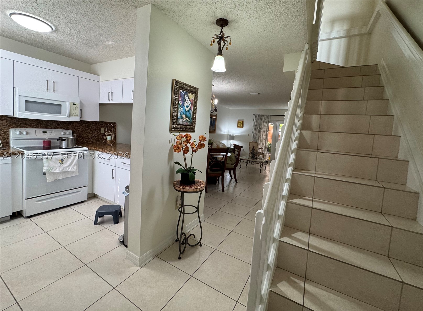 Welcome to this very well-maintained 2-bedroom, 1.5-bath, two-story townhome located in the desirable gated community of West 74 Street Condo in Hialeah. This move-in-ready rental features tile flooring throughout, a spacious kitchen with breakfast bar seating, and a convenient half bath on the first floor. The functional layout offers generous living and dining areas downstairs, while both bedrooms and the full bathroom are upstairs. Enjoy the convenience of a washer and dryer located in the patio, along with two assigned parking spaces. Ideally located near shopping, dining, schools, and major highways, this home offers comfort, convenience, and an excellent location. Available furnished or unfurnished. Tenant is responsible for all utilities.